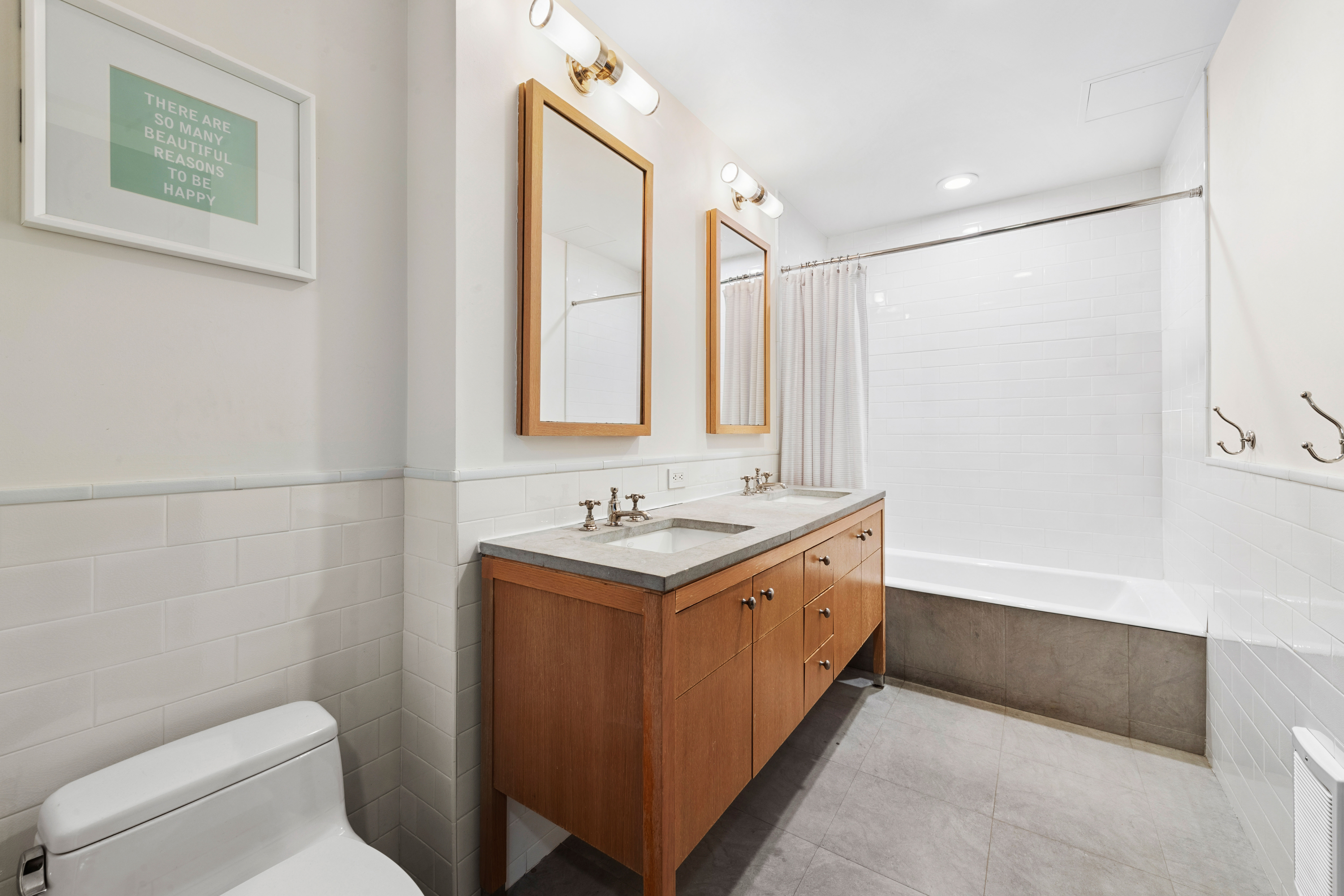 245 West 99th Street, Unit 8A Manhattan, NY 10025 - Photo 11 of 12 a bathroom with a granite countertop sink a toilet and a mirror