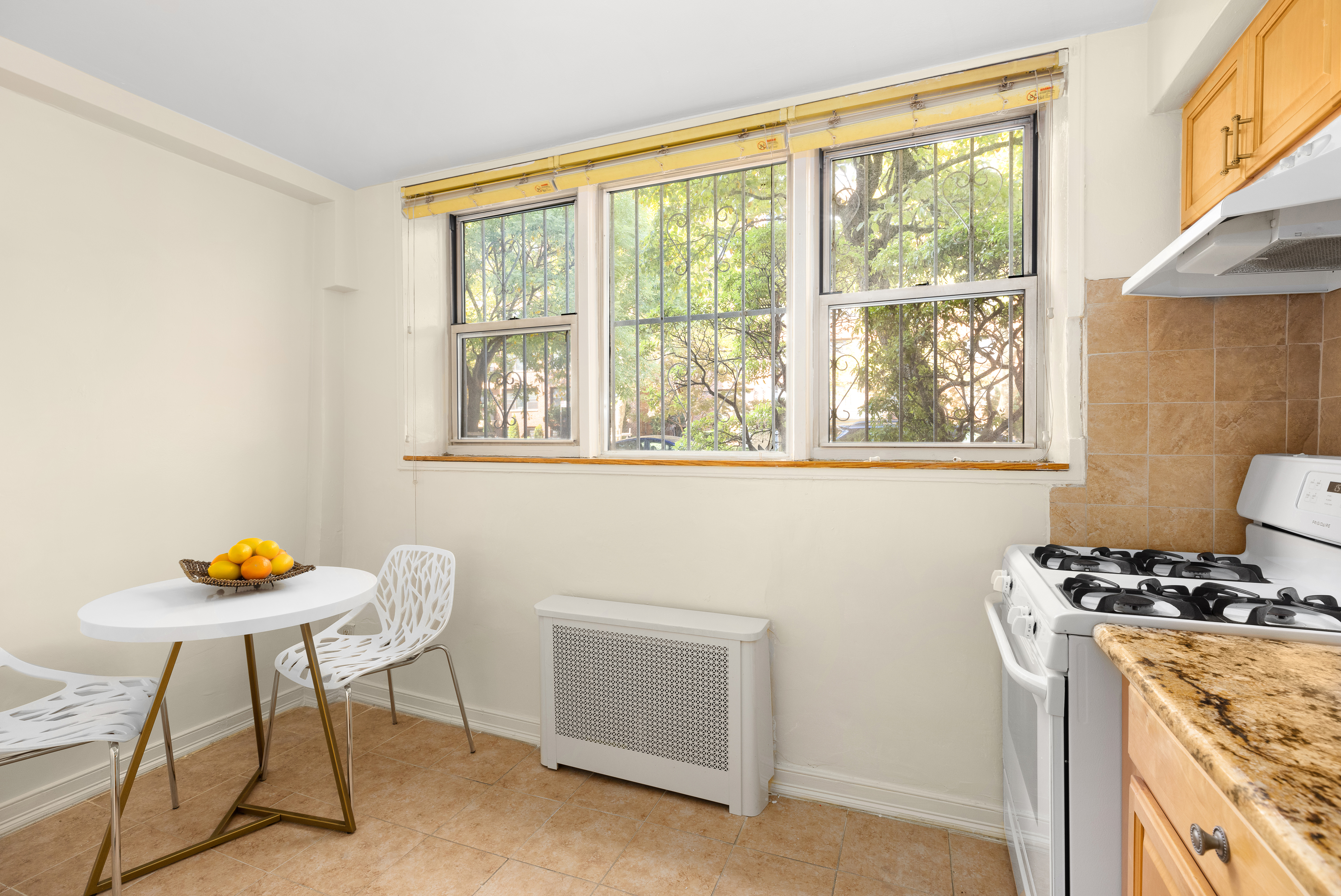 310 Beverley Road, Unit LB Brooklyn, NY 11218 - Photo 3 of 9 a view of a workspace with furniture and a window