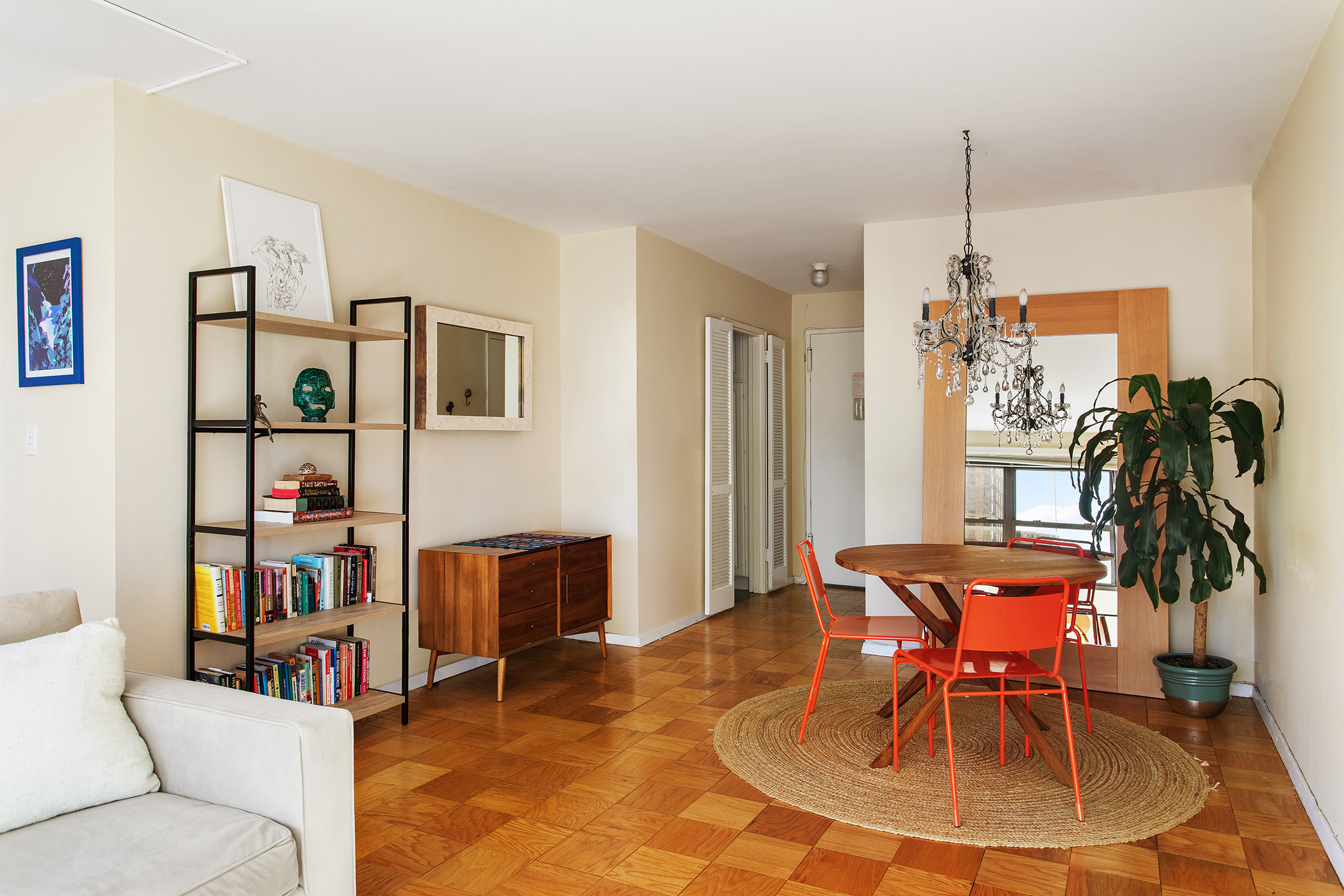 160 West End Avenue, Unit 23C Manhattan, NY 10023 - Photo 3 of 5 a living room with furniture a dining table and a fireplace