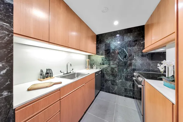 a kitchen with a sink and cabinets