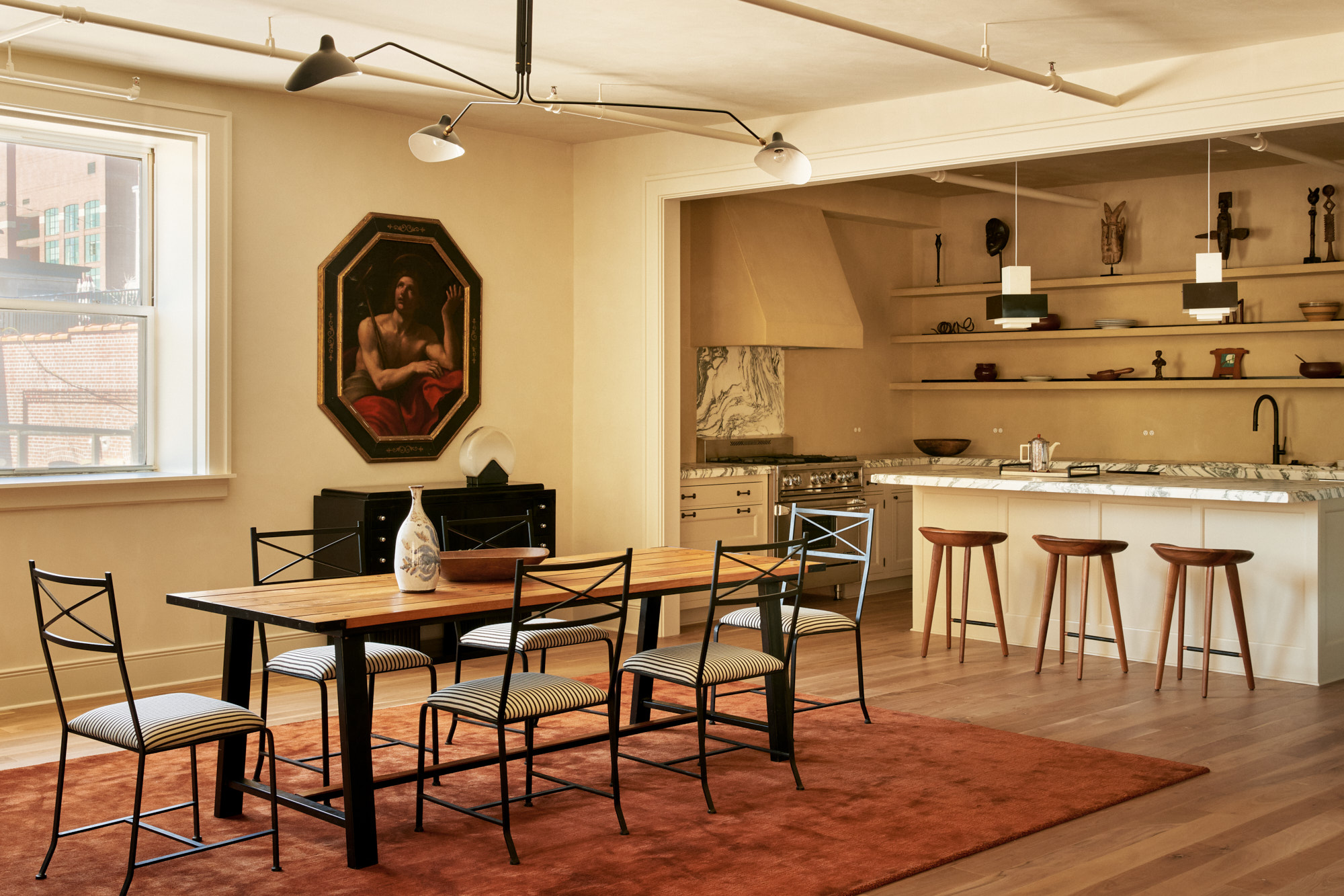 285 Lafayette Street, Unit 5D Manhattan, NY 10012 - Photo 8 of 22 a table and chairs in a room and kitchen view