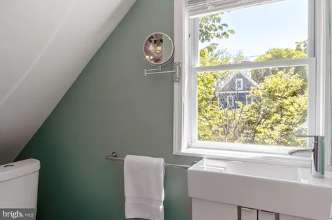 a bathroom with a sink and a window