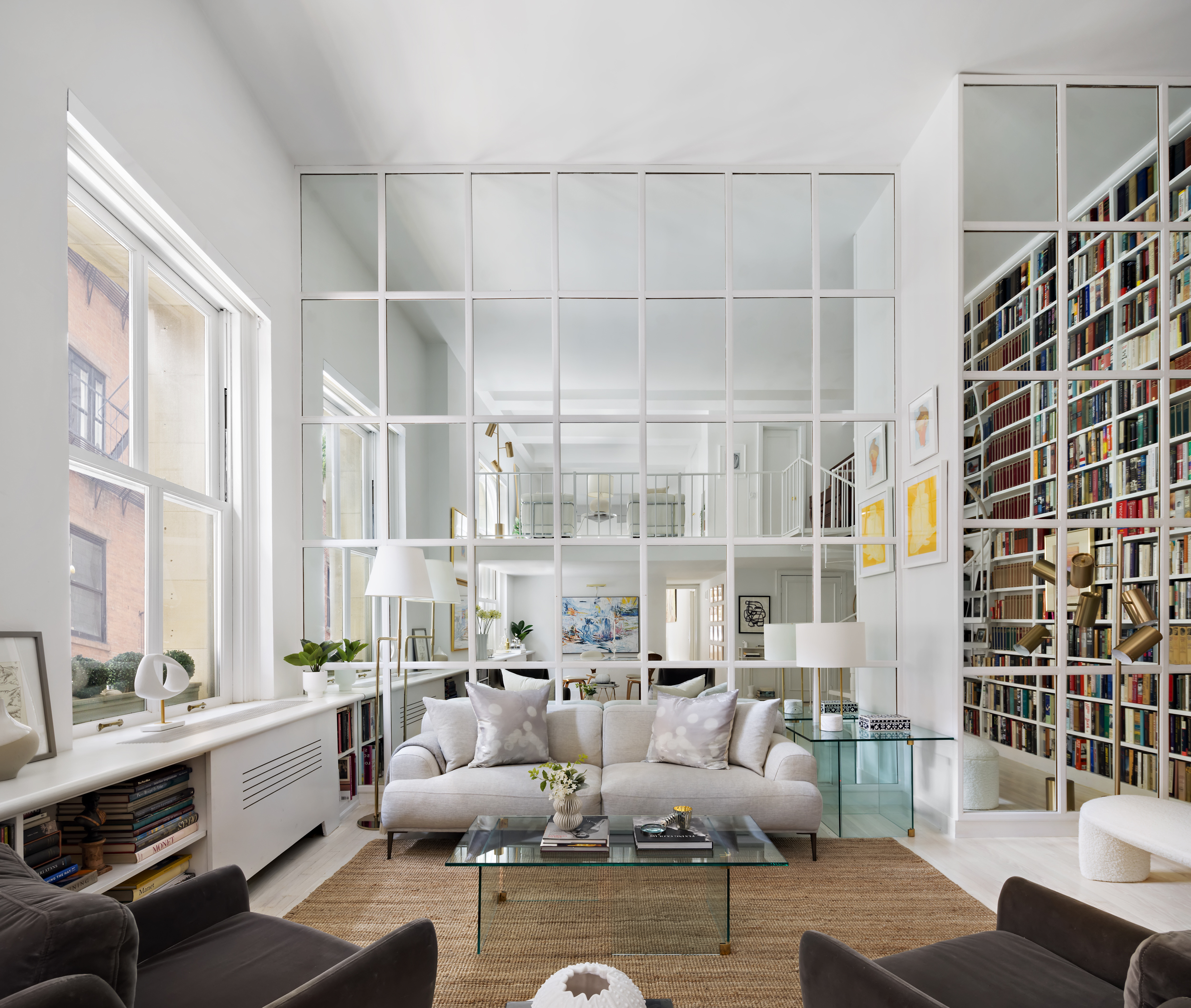 240 Centre Street, Unit 2J Manhattan, NY 10013 - Photo 2 of 18 a living room with furniture and large windows