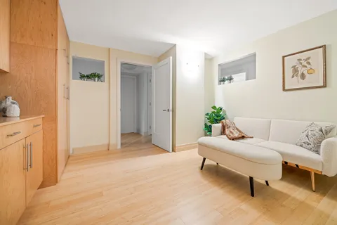 a living room with furniture and a bed