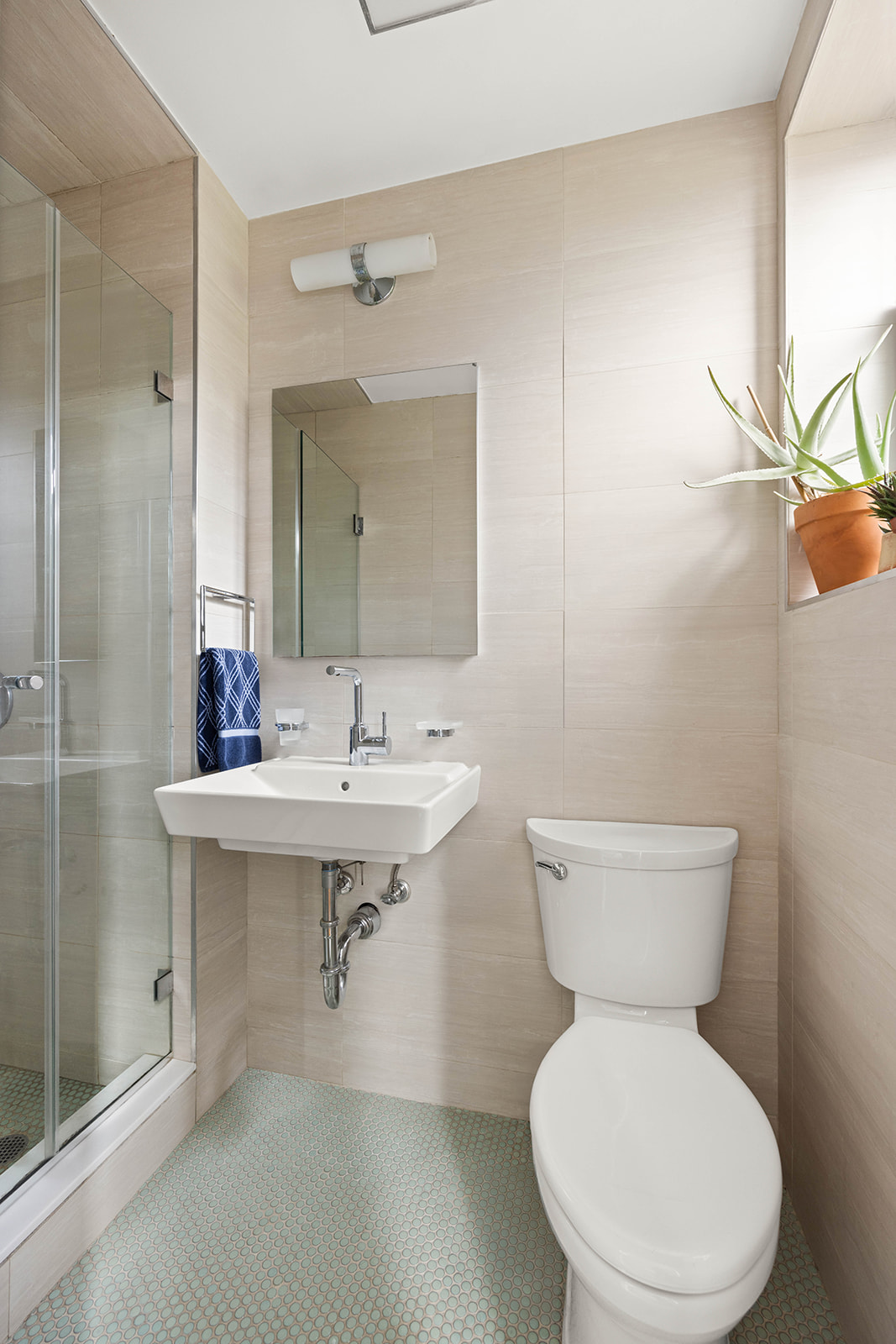 100 Ocean Parkway, Unit 3H Brooklyn, NY 11218 - Photo 9 of 11 a bathroom with a toilet sink and mirror