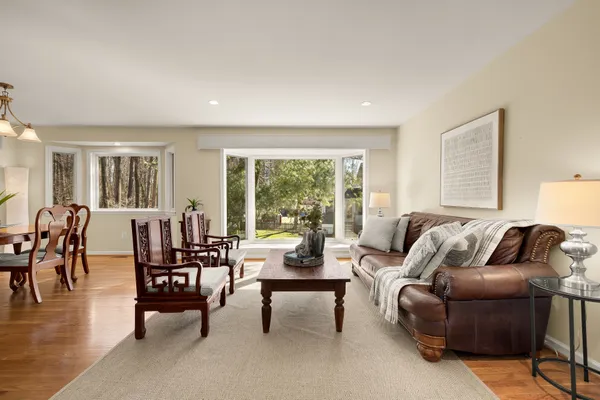 a view of a dining room with furniture window and wooden floor