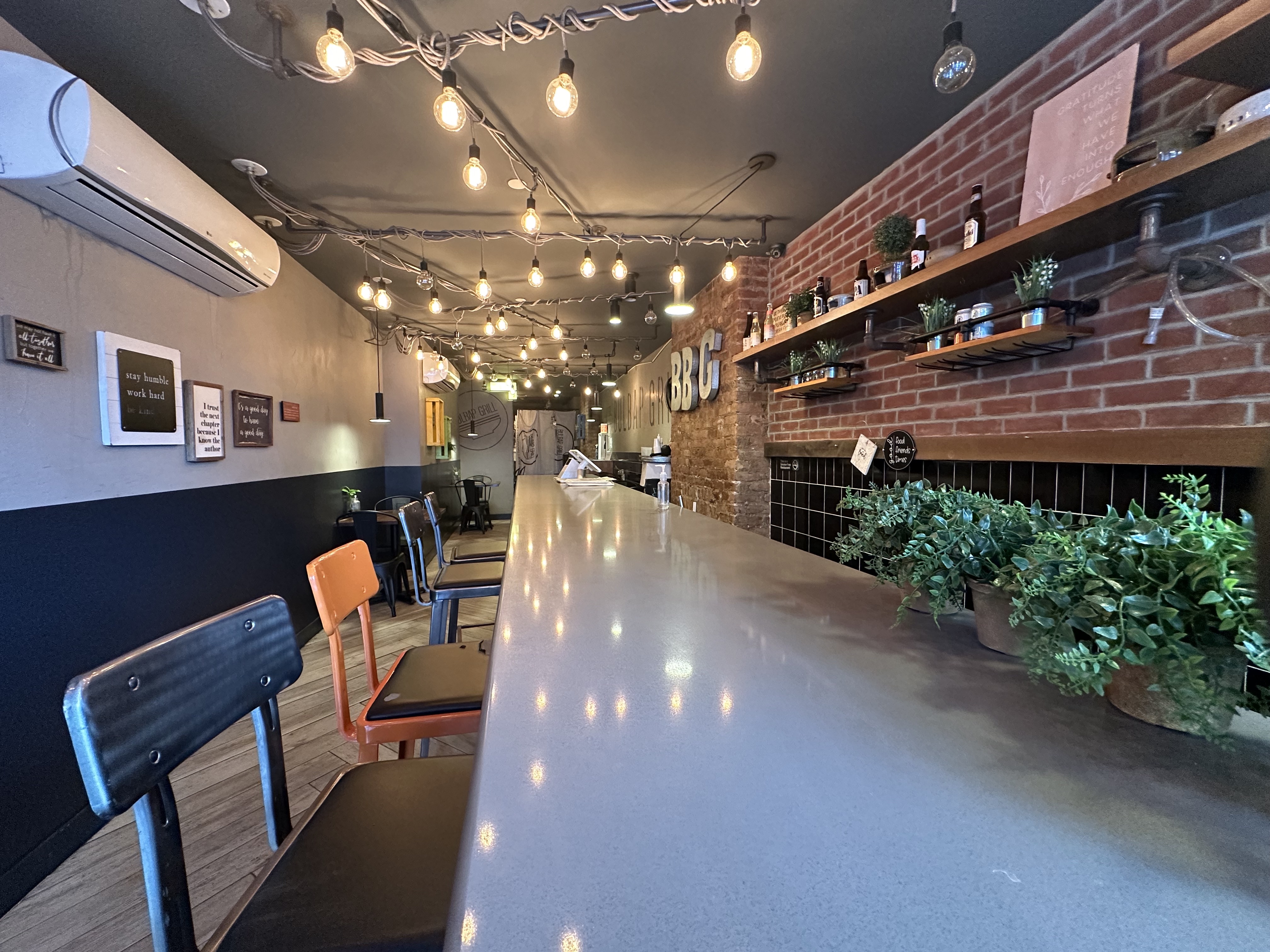 Wyckoff Avenue Brooklyn, NY 11237 - Photo 4 of 9 a view of a patio with table and chairs a barbeque with potted plants