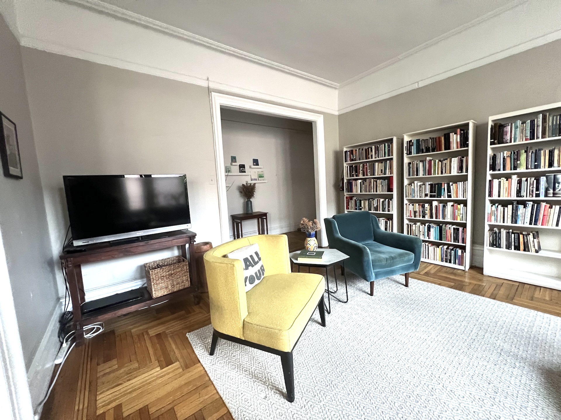59 Livingston Street, Unit 4C Brooklyn, NY 11201 - Photo 6 of 11 a living room with furniture and a flat screen tv
