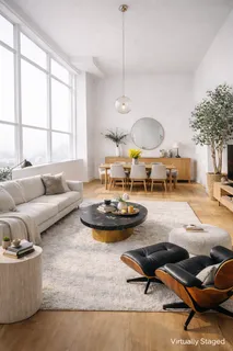 a view of a chair and table in backyard of the house