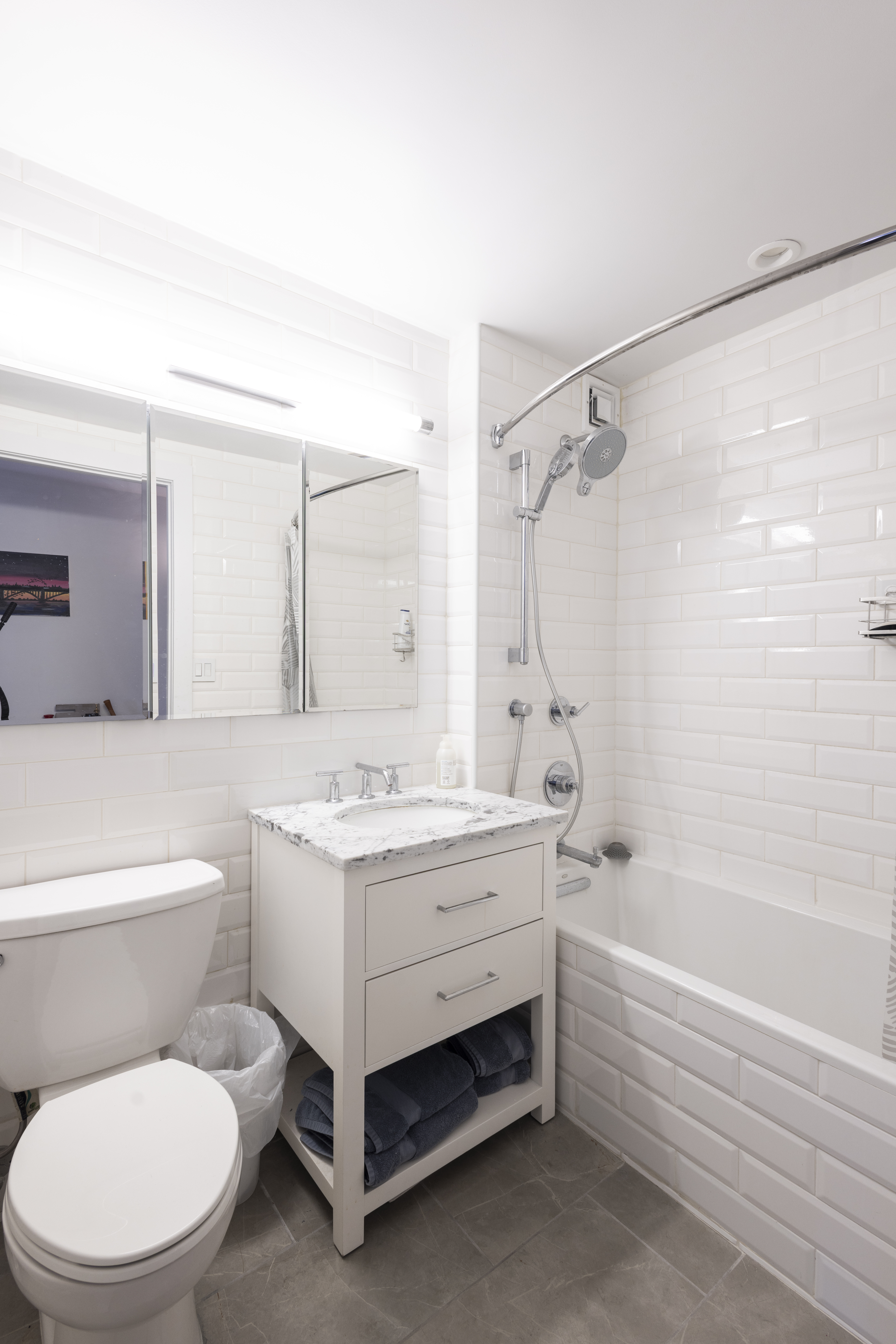 1330 5th Avenue, Unit 6C Manhattan, NY 10026 - Photo 10 of 16 a bathroom with a sink toilet vanity and shower