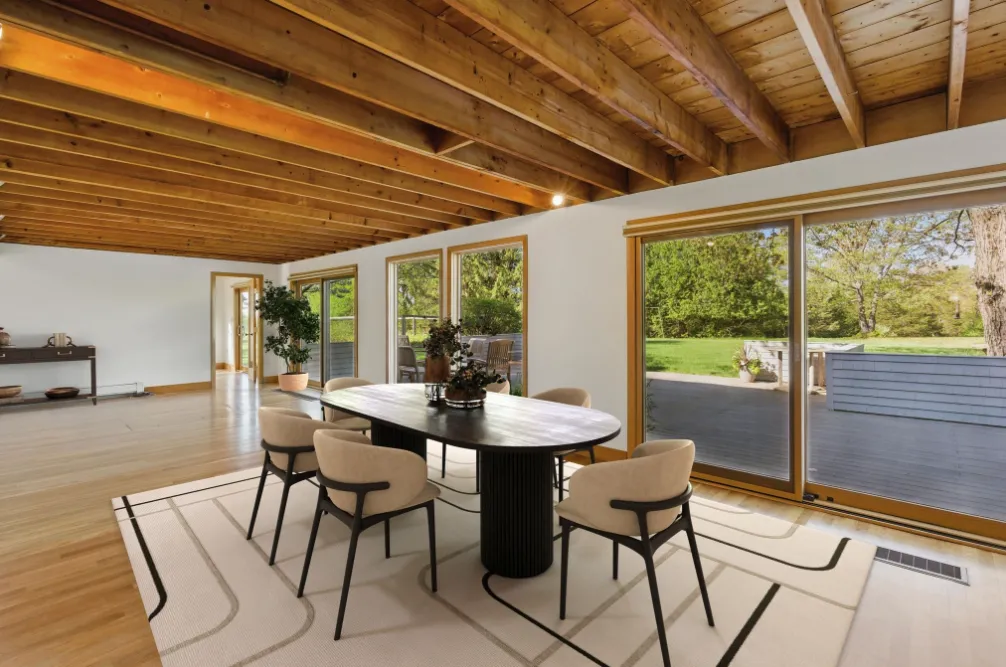 a dining room with furniture and window