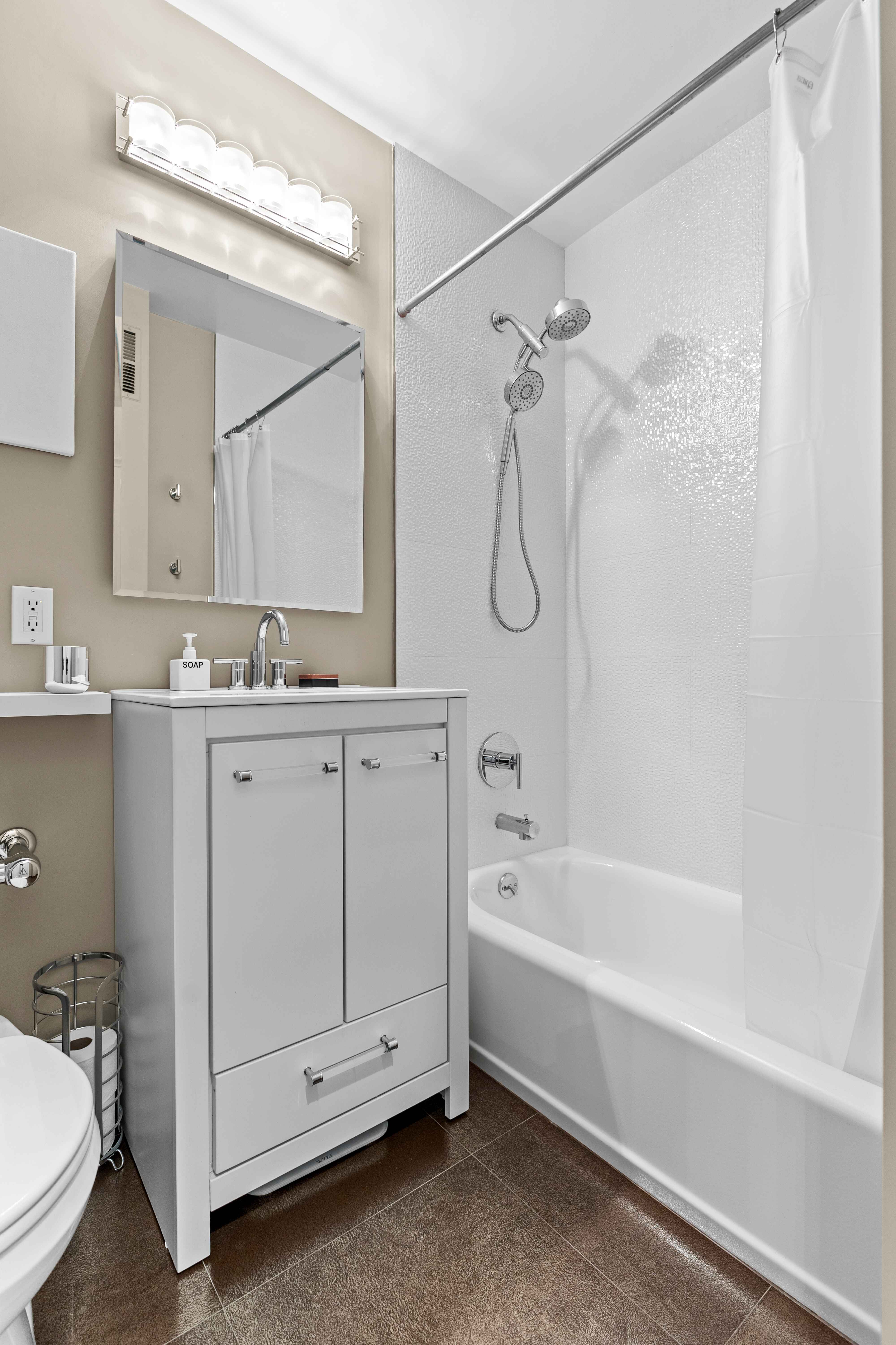 263 West End Avenue, Unit 6E Manhattan, NY 10023 - Photo 9 of 12 a bathroom with a sink a toilet and a bathtub