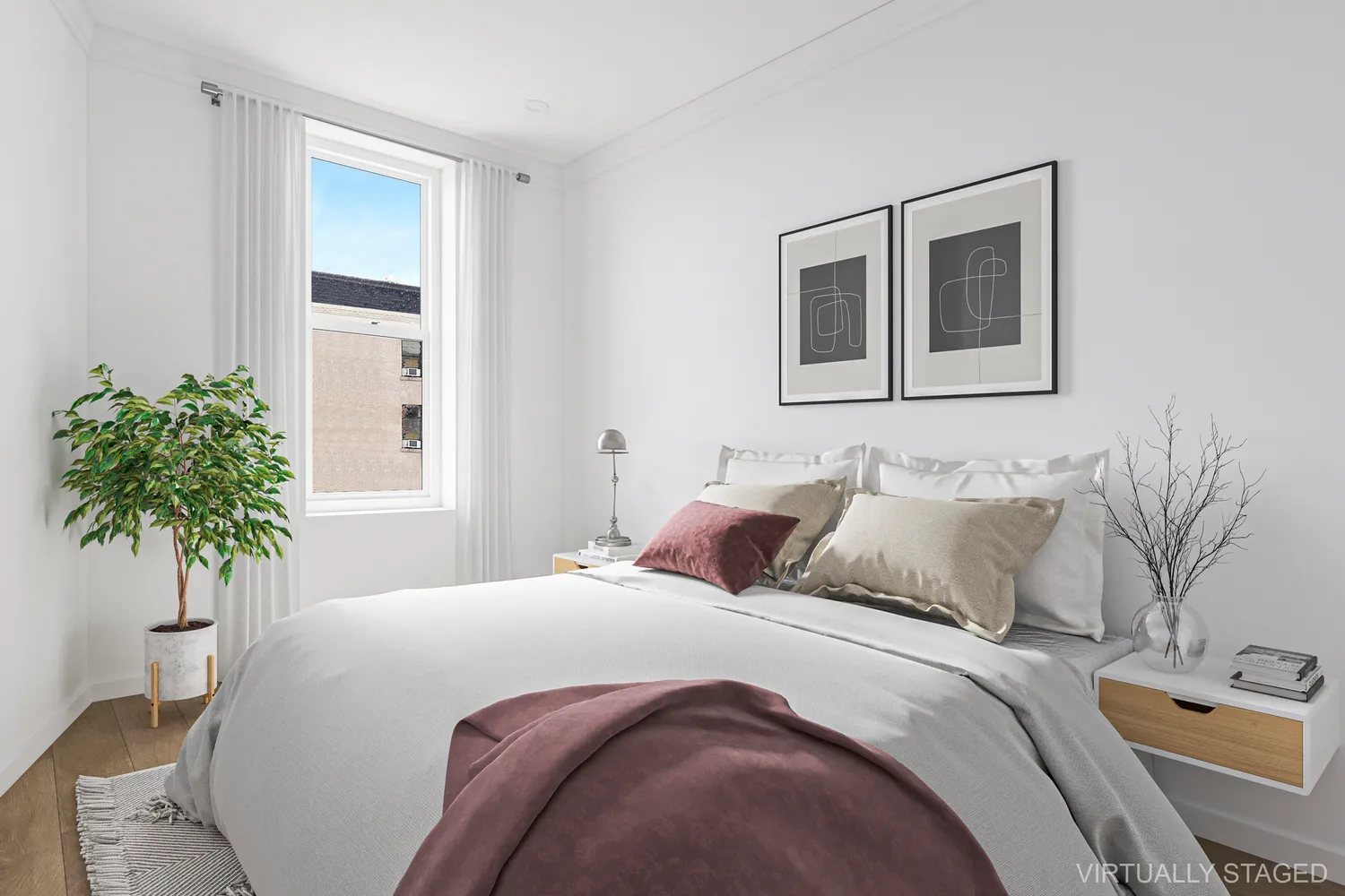 a bedroom with a bed and a potted plant