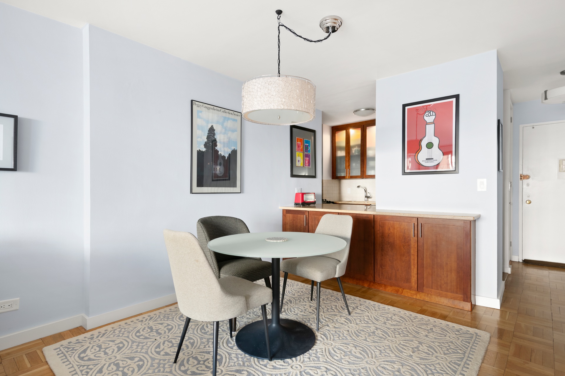 10 West 66th Street, Unit 7C Manhattan, NY 10023 - Photo 3 of 19 a dining room with furniture and window