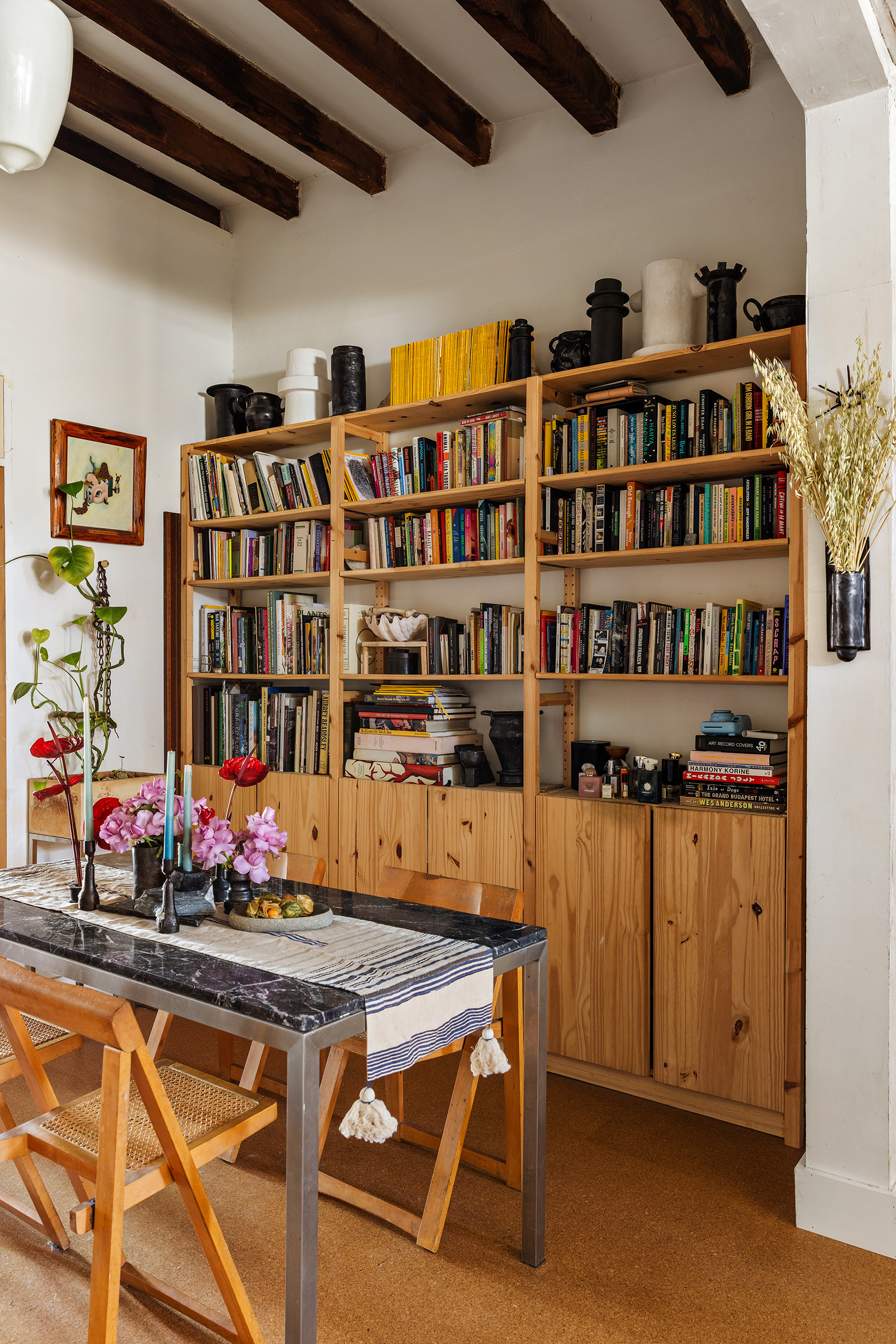 151 Grand Street, Unit 8 Brooklyn, NY 11249 - Photo 7 of 20 a living room with lots of furniture and flowers