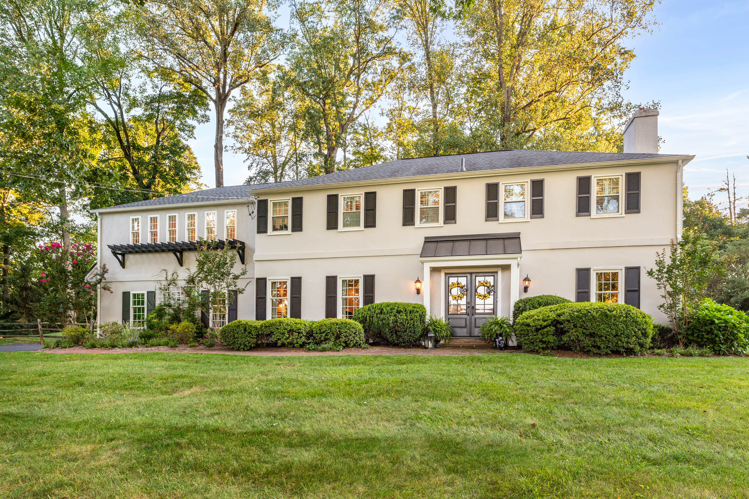 a front view of a house with garden