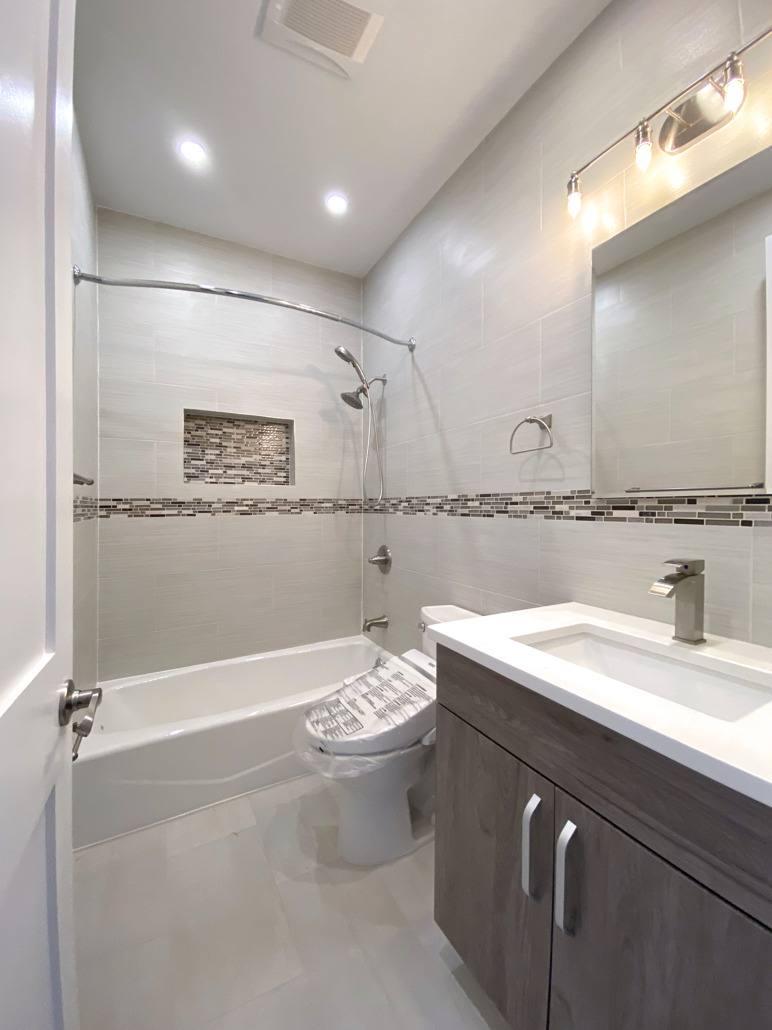 175 Luquer Street, Unit 3 Brooklyn, NY 11231 - Photo 7 of 12 a bathroom with a sink a toilet and a mirror