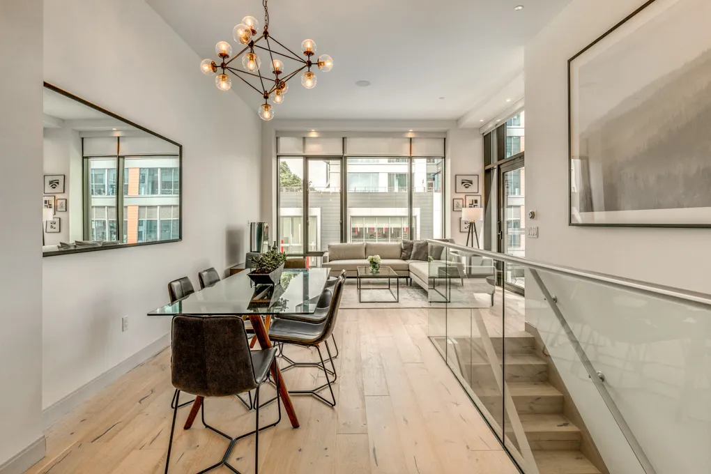 a view of a dining room with furniture window and outside view
