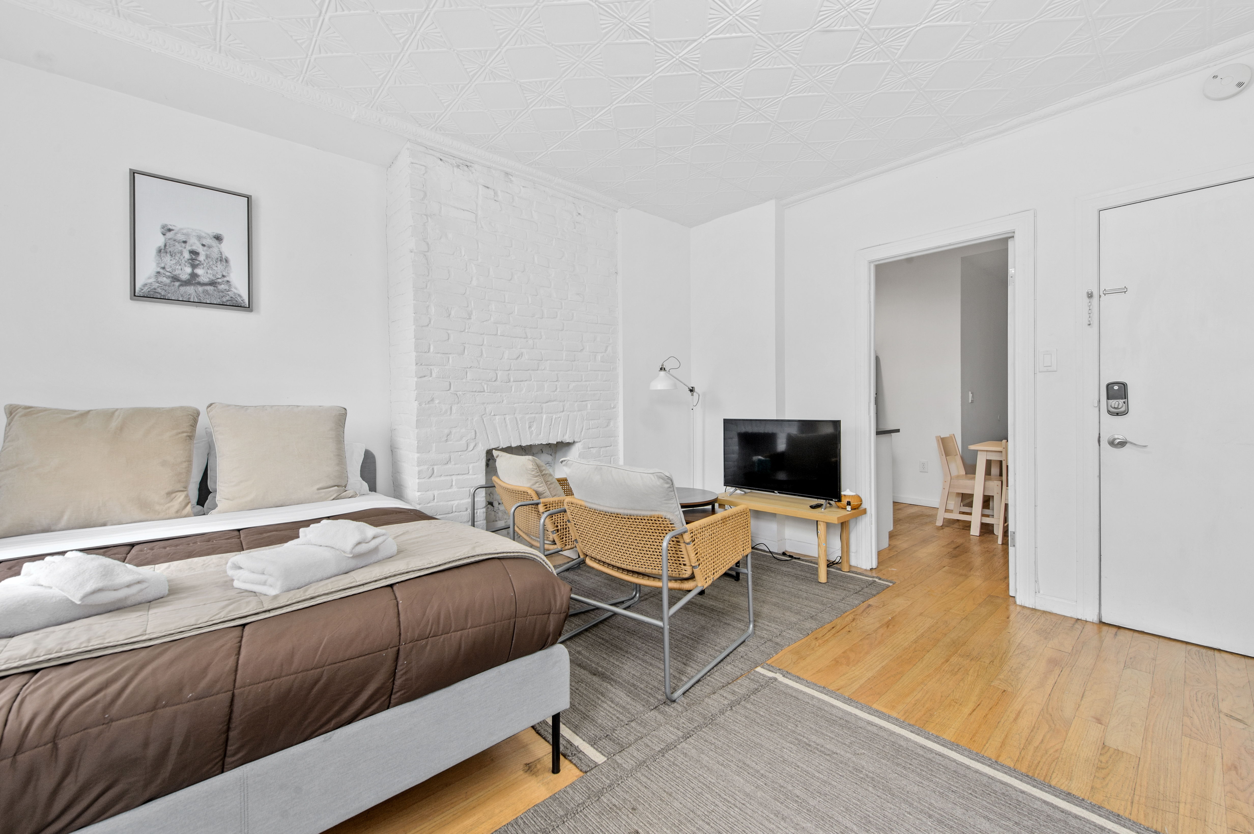185 A Powers Street, Unit 1 Brooklyn, NY 11211 - Photo 4 of 13 a bedroom with a bed and wooden floor