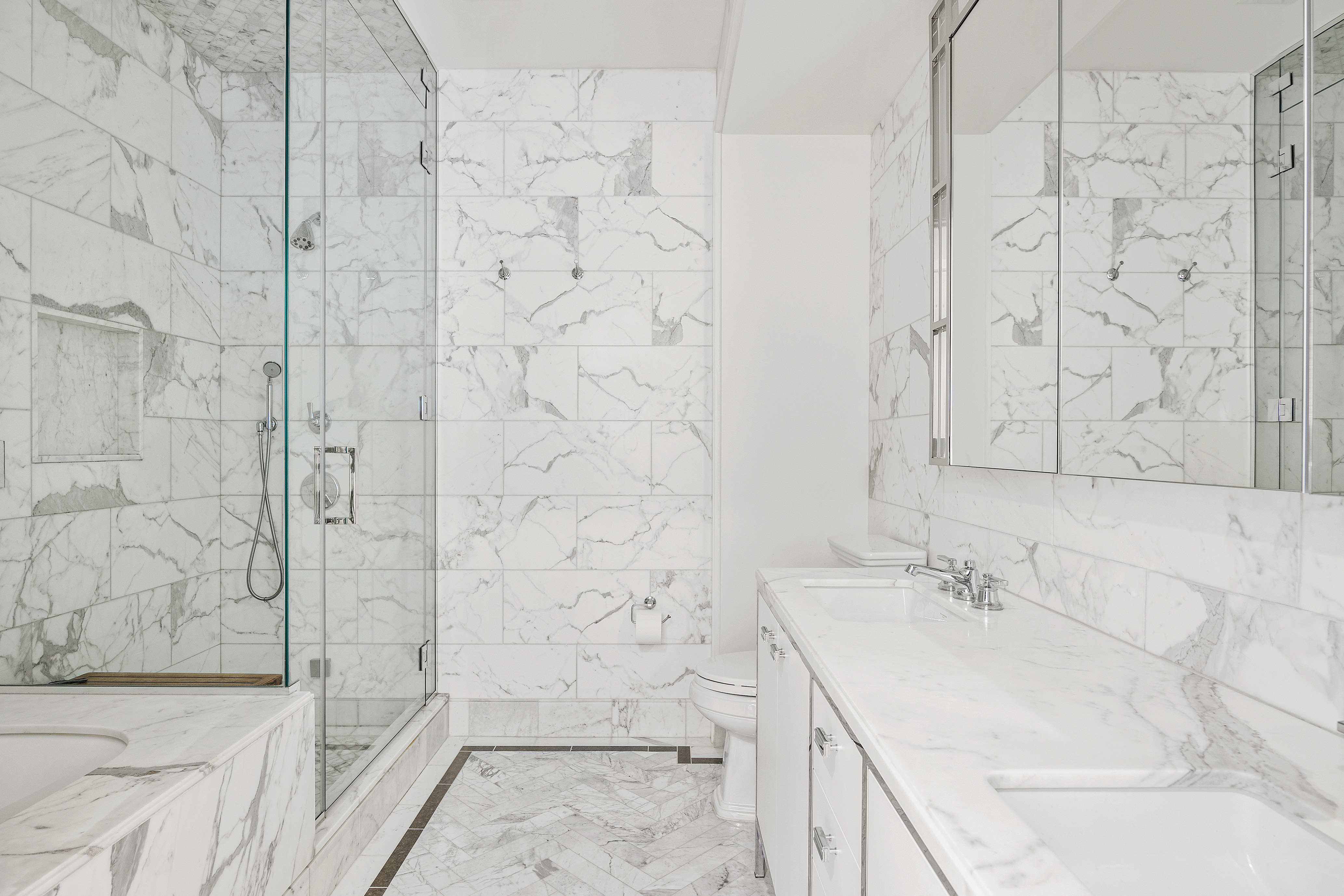 100 Barclay Street, Unit 16D Manhattan, NY 10007 - Photo 13 of 14 a bathroom with a sink shower and a mirror