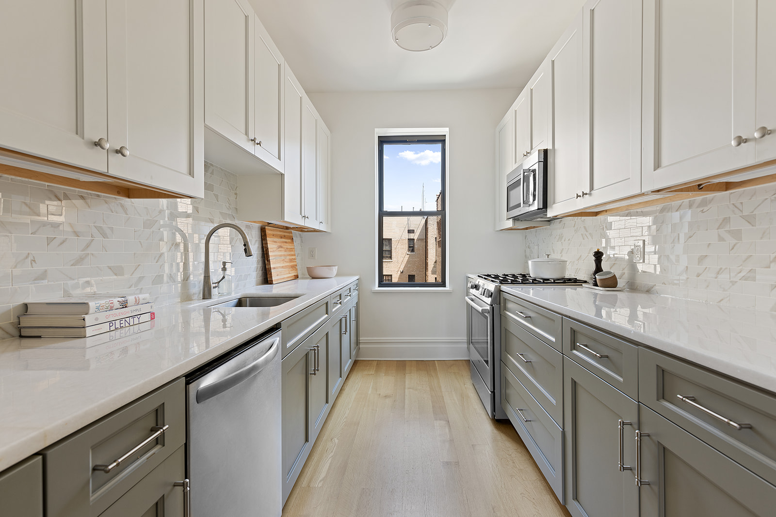 225 Eastern Parkway, Unit 6C Brooklyn, NY 11238 - Photo 3 of 12 a kitchen with sink a stove and cabinets
