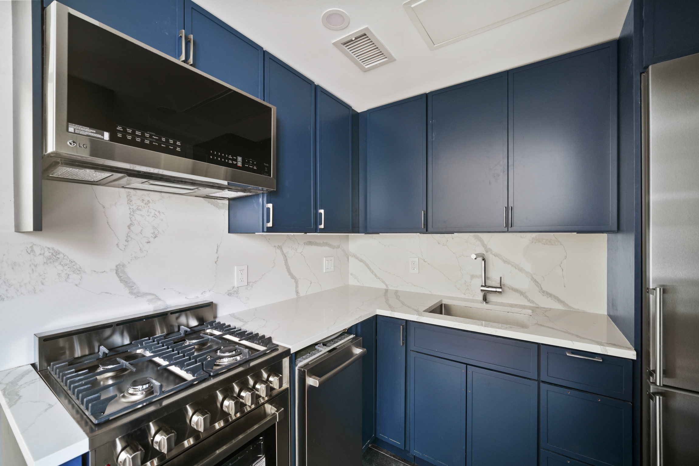 441 Metropolitan Avenue, Unit 1 Brooklyn, NY 11211 - Photo 4 of 11 a kitchen with a sink and a stove top oven