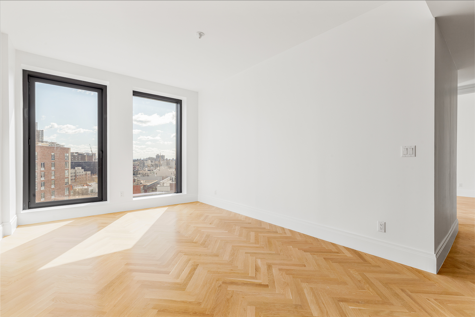 300 West 122nd Street, Unit 12C Manhattan, NY 10027 - Photo 3 of 11 a view of an empty room with a window