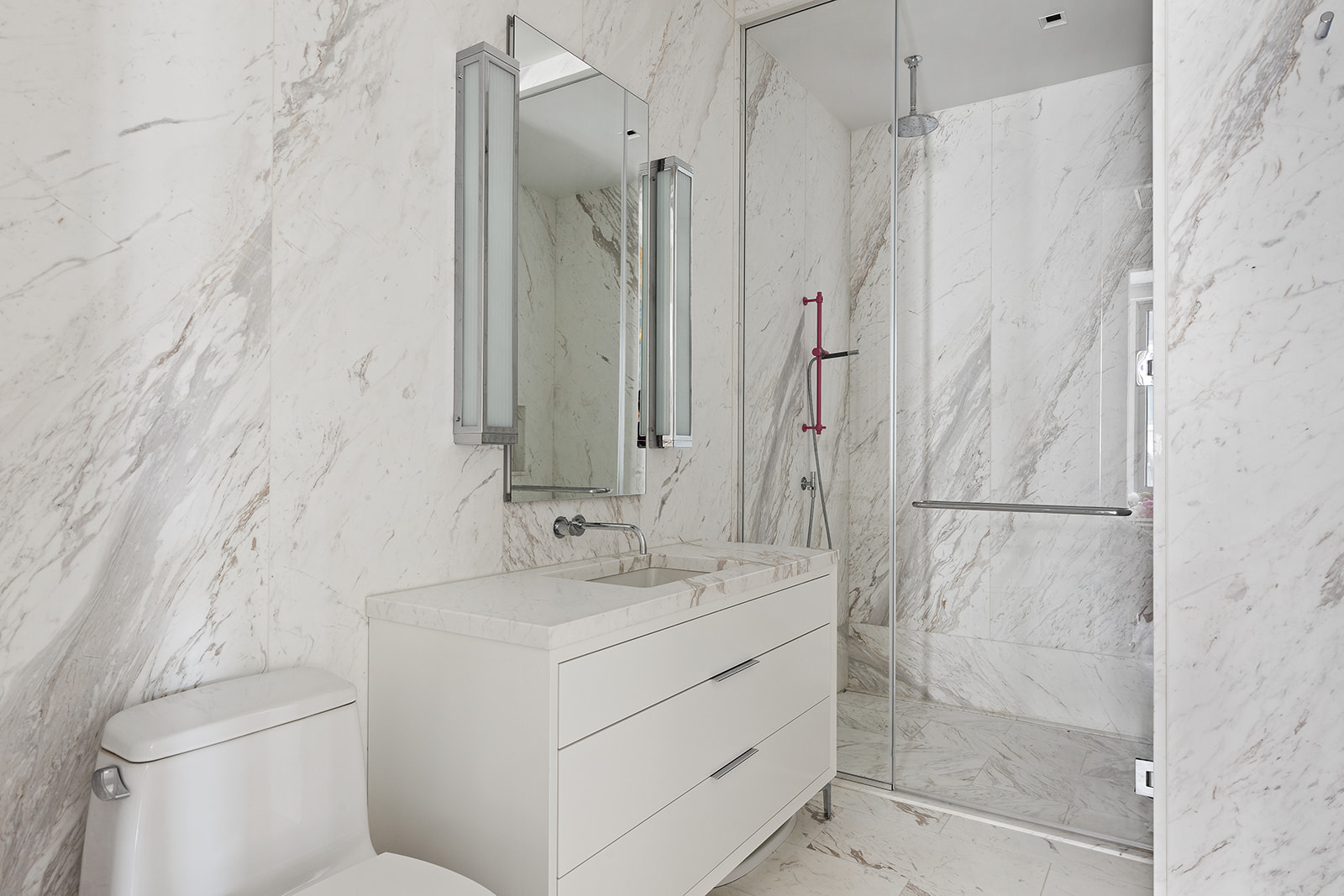 601 Washington Street, Unit 3W Manhattan, NY 10014 - Photo 12 of 15 a bathroom with a sink toilet and shower