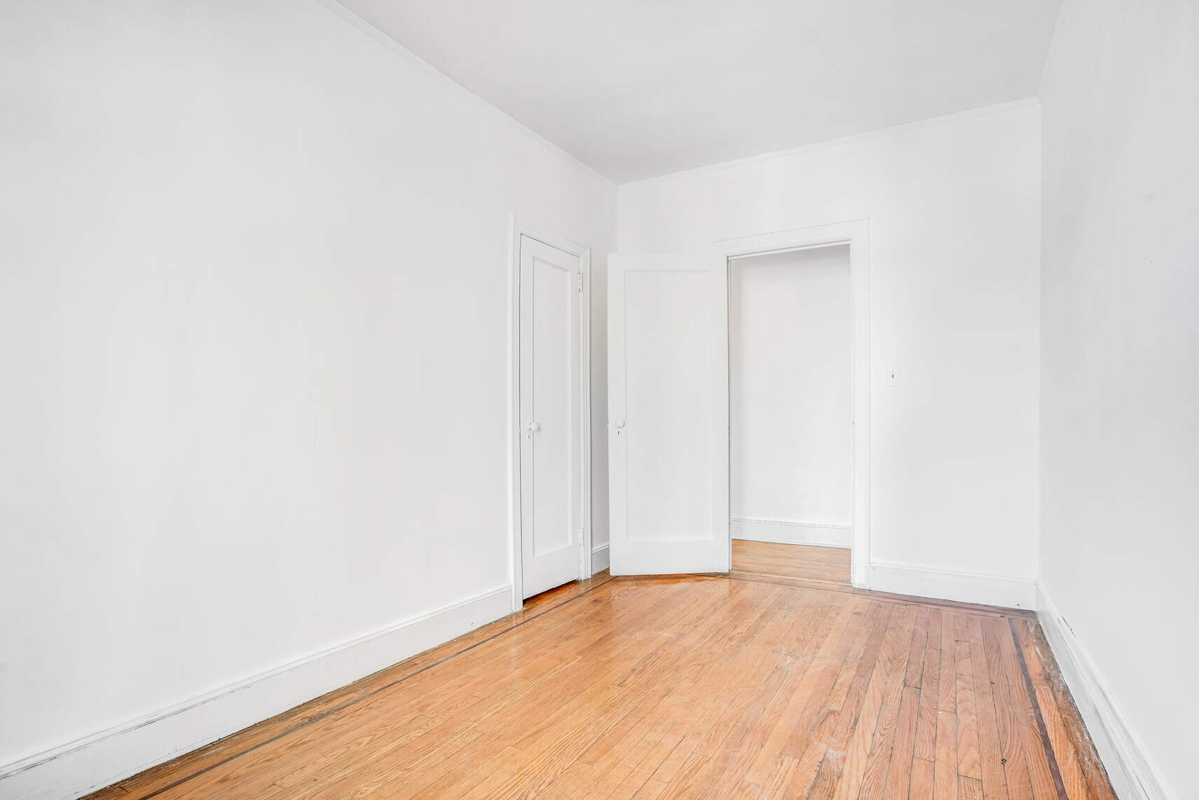 8301 4th Avenue Brooklyn, NY 11209 - Photo 11 of 20 a view of empty room with wooden floor