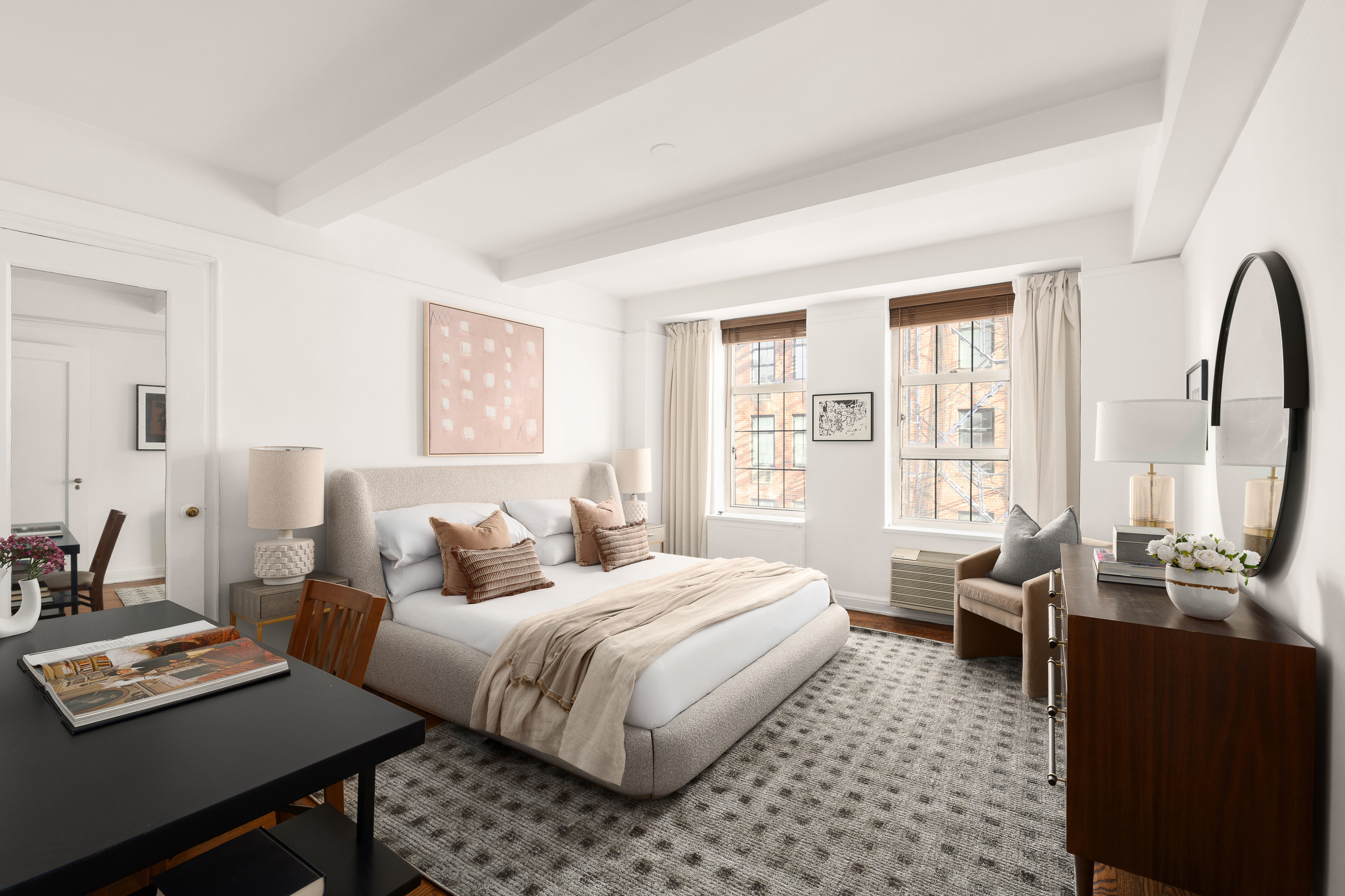 465 West 23rd Street, Unit 10A Manhattan, NY 10011 - Photo 5 of 12 a bedroom with a bed and large windows