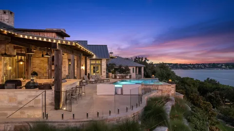 a view of swimming pool with outdoor seating