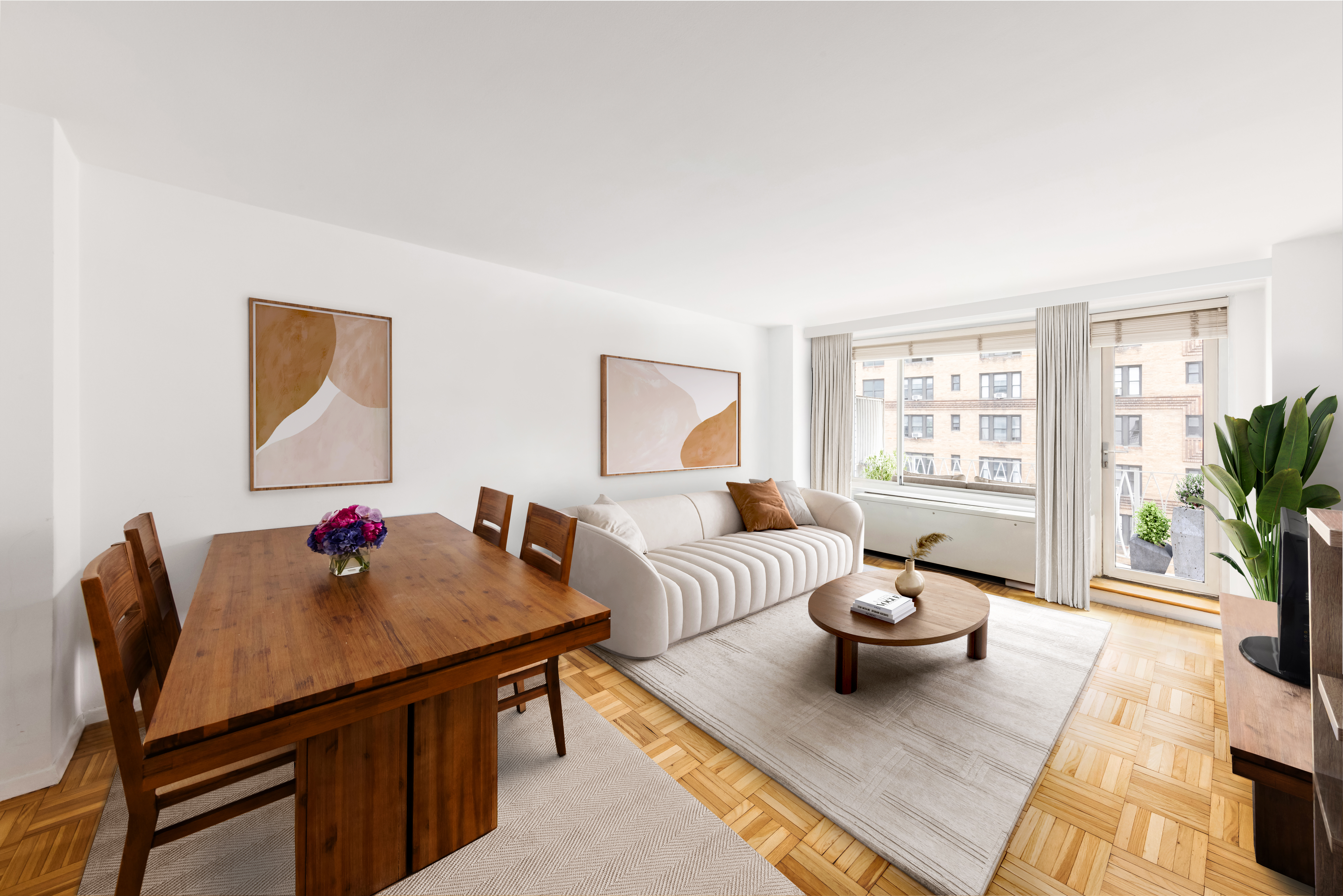 1160 3rd Avenue, Unit 15H Manhattan, NY 10065 - Photo 1 of 7 a living room with furniture and a potted plant
