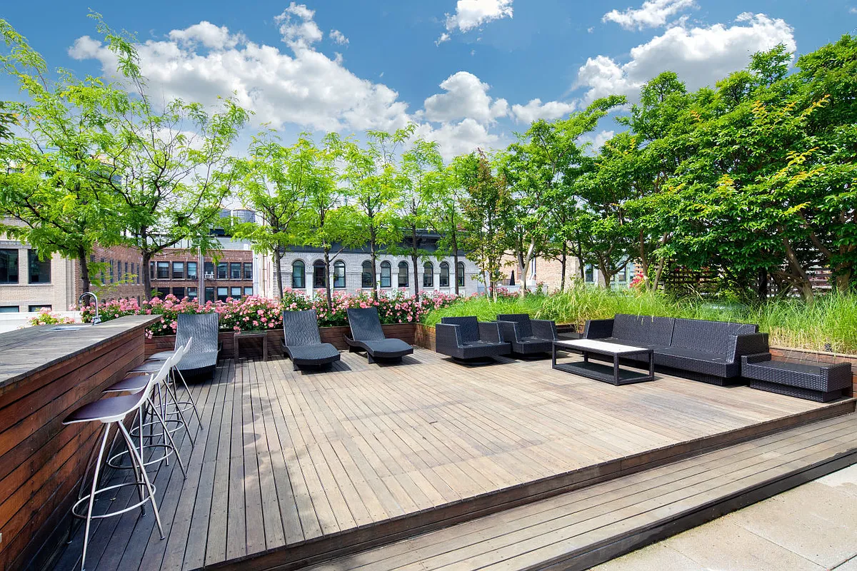 133 West 22nd Street, Unit 6A Manhattan, NY 10011 - Photo 8 of 9 a view of a patio with couches table and chairs and potted plants