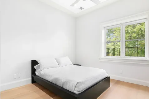 a kitchen with stainless steel appliances granite countertop a stove a sink and a wooden floor