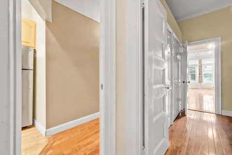 a view of an entryway with a floor to ceiling window