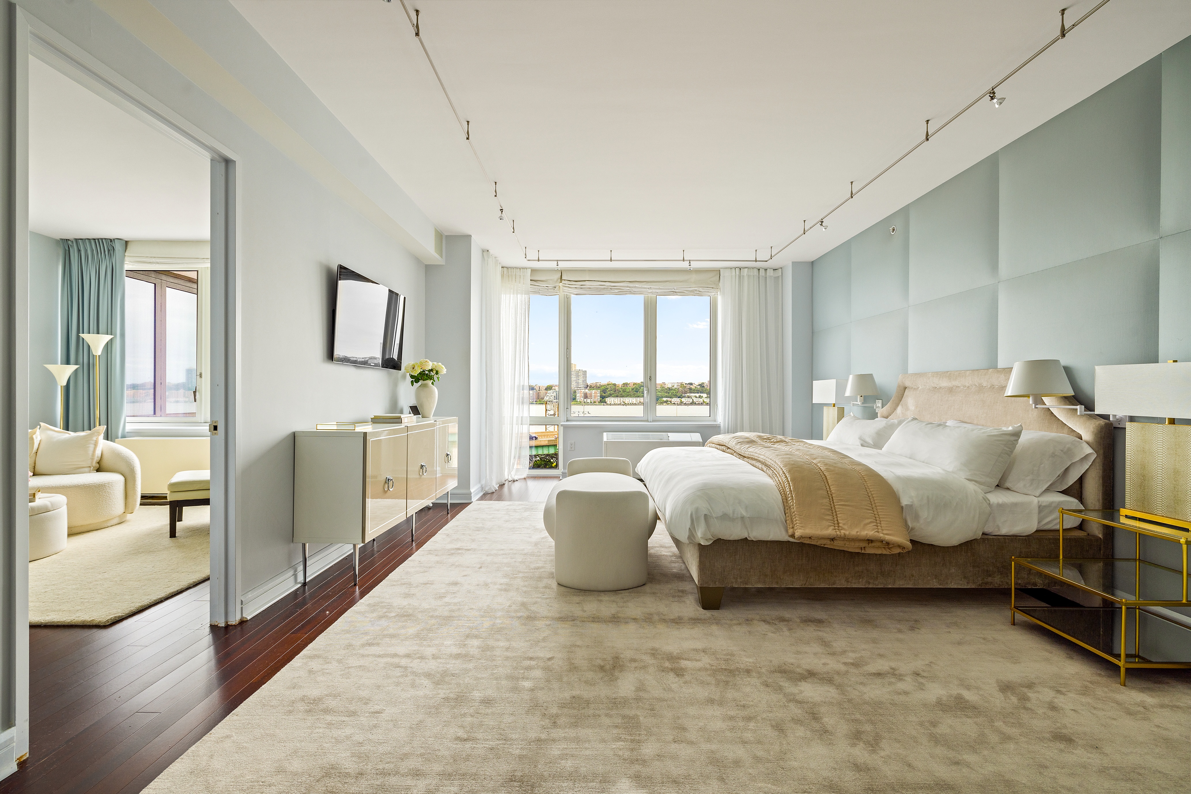 80 Riverside Boulevard, Unit 6B/L Manhattan, NY 10069 - Photo 5 of 17 a spacious bedroom with a bed and large windows