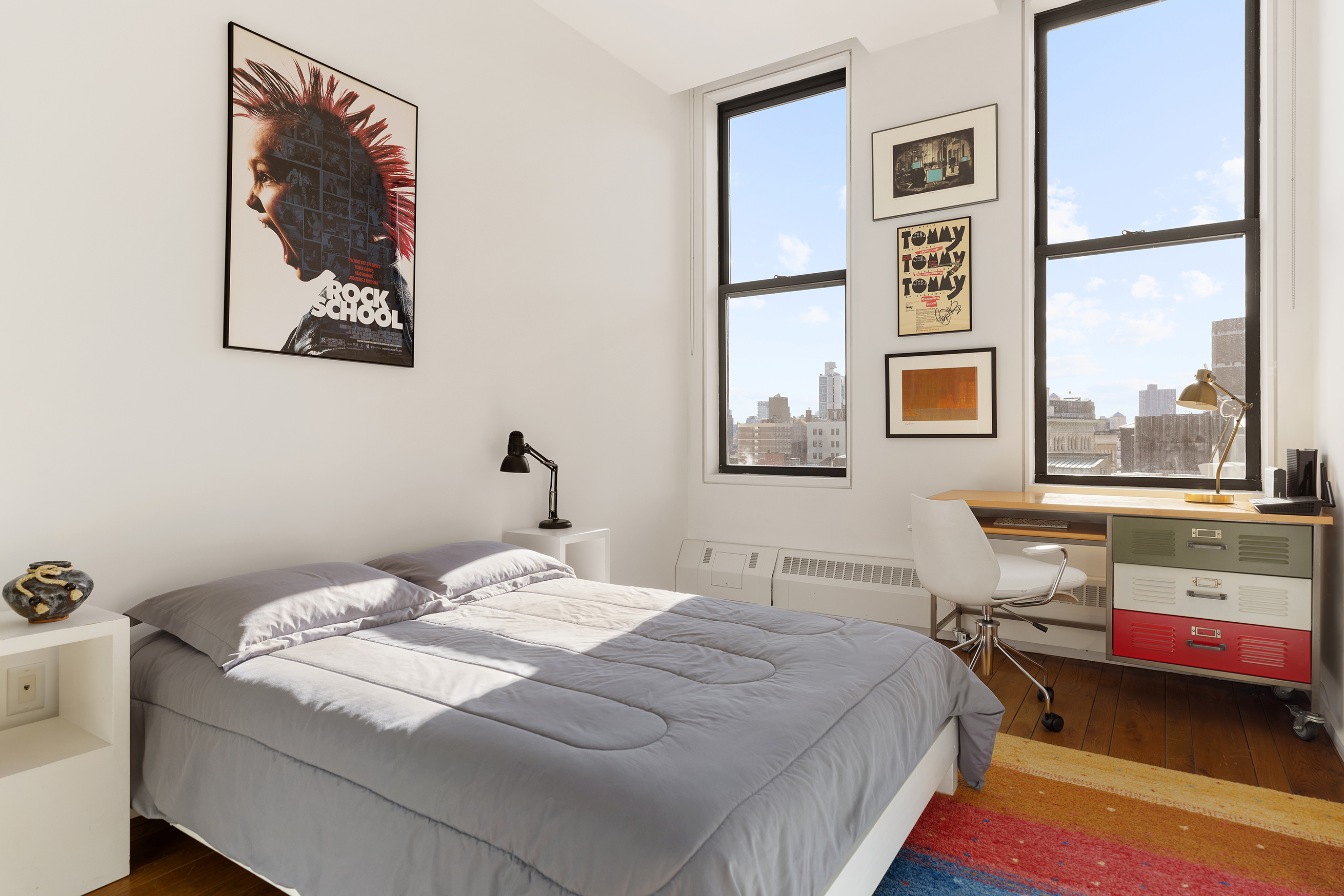 21 Astor Place, Unit 9E Manhattan, NY 10003 - Photo 9 of 10 a bedroom with a bed and a window