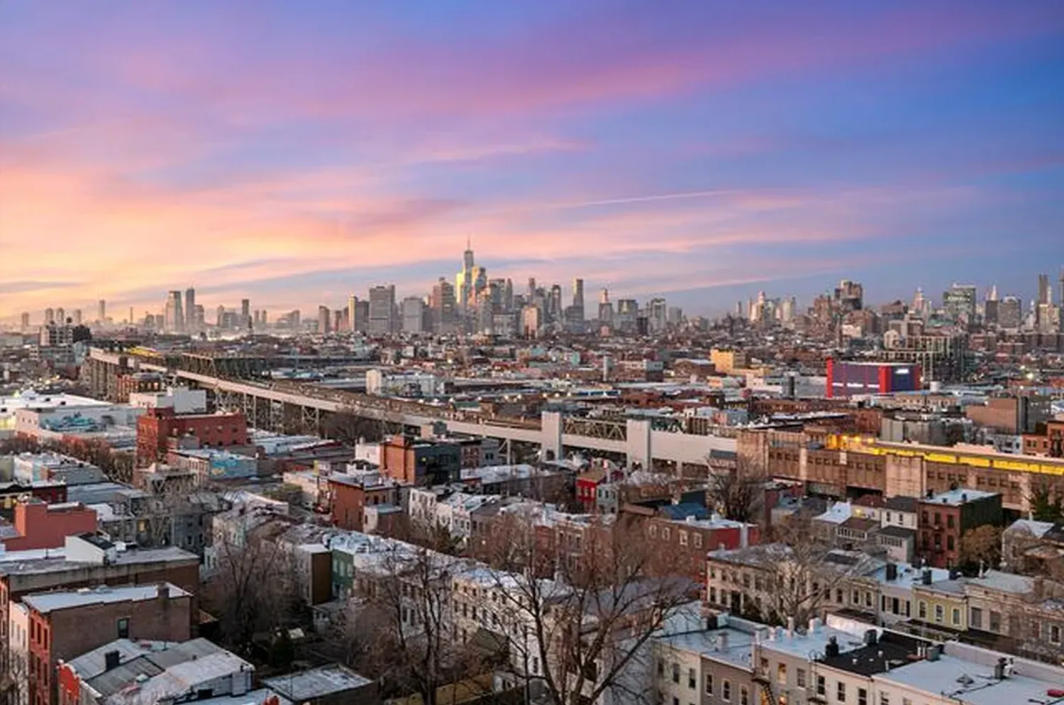 a view of a city with tall buildings