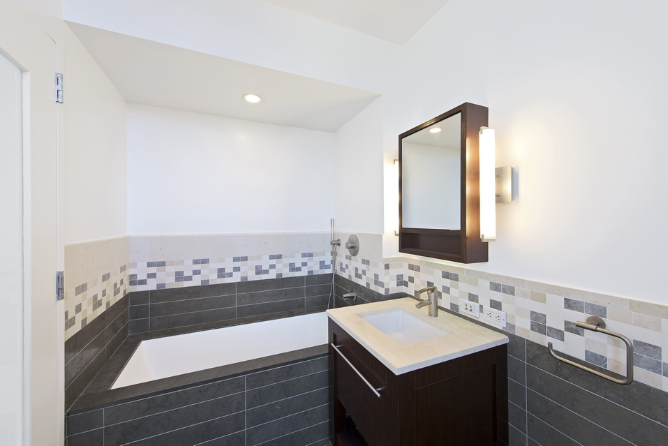 101 West 24th Street, Unit 26A Manhattan, NY 10011 - Photo 8 of 21 a bathroom with a sink and a mirror