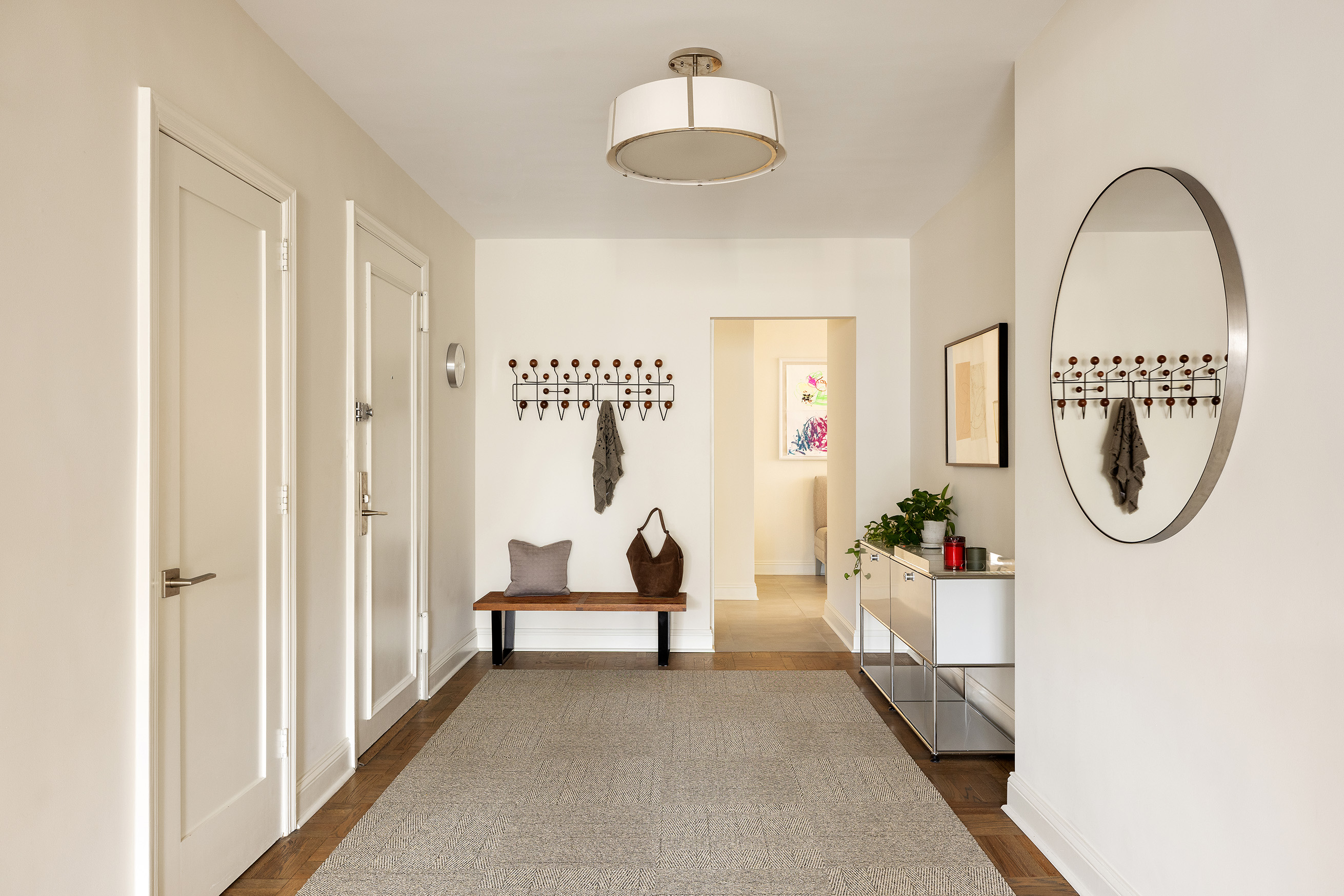 135 East 83rd Street, Unit 14B Manhattan, NY 10028 - Photo 4 of 16 a living room with furniture and a window