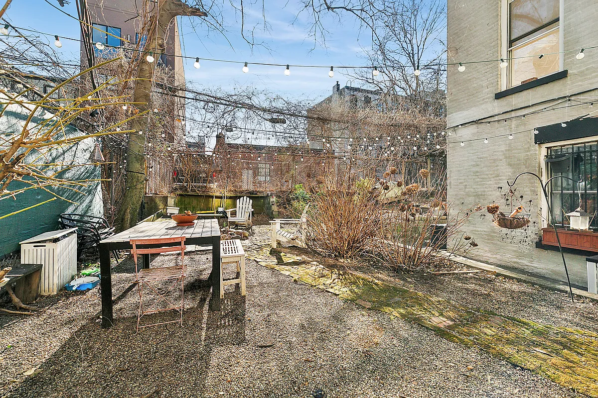 1102 Dean Street, Unit 4 Brooklyn, NY 11216 - Photo 8 of 12 a backyard of a house with outdoor seating