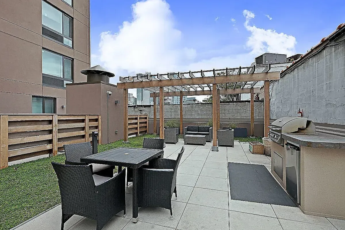 a view of a patio with table and chairs