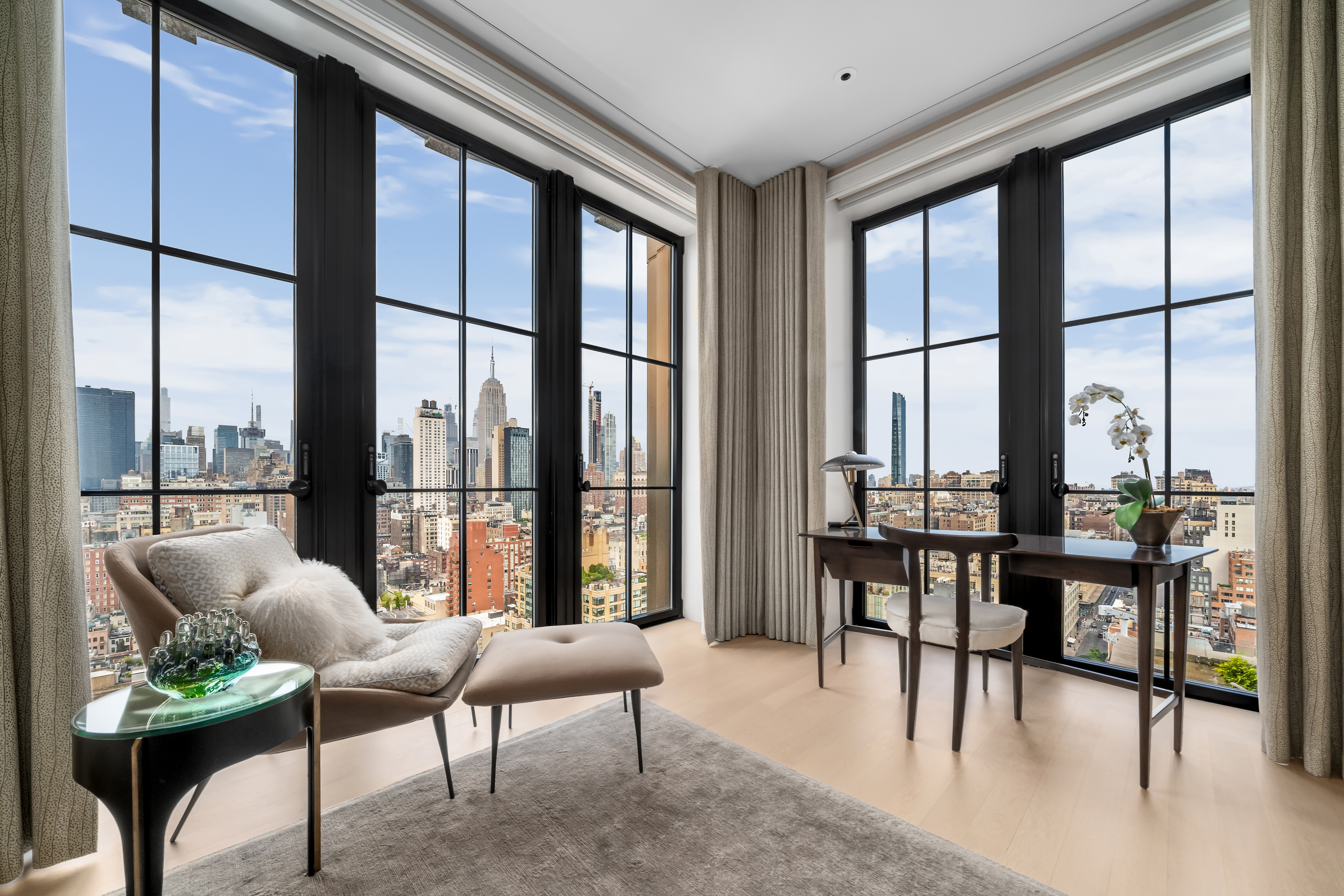 212 West 18th Street, Unit 19C Manhattan, NY 10011 - Photo 8 of 27 a living room with furniture and a large window