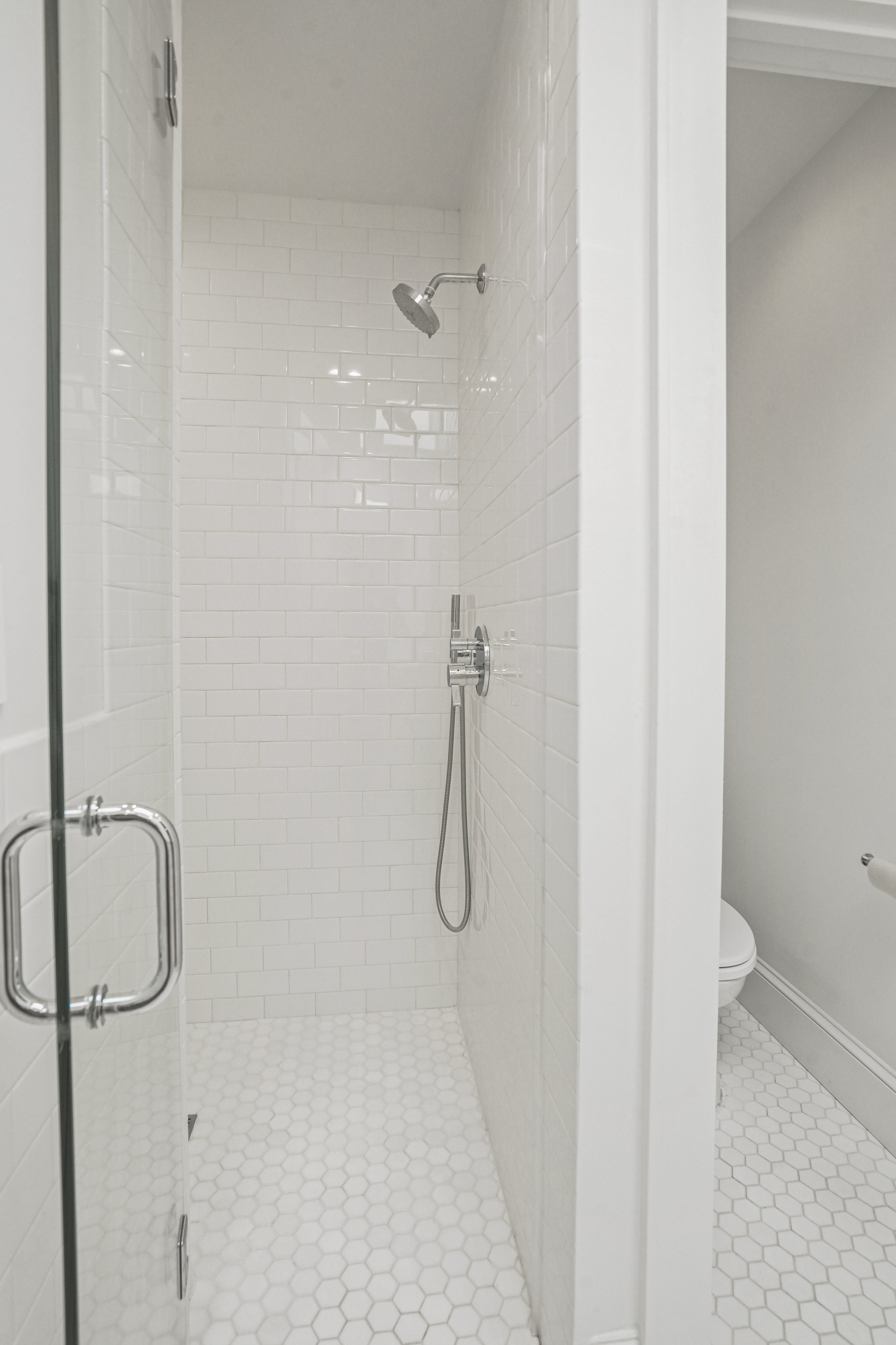 1920 35th Street Northwest Washington, DC 20007 - Photo 22 of 54 a bathroom with a glass shower door