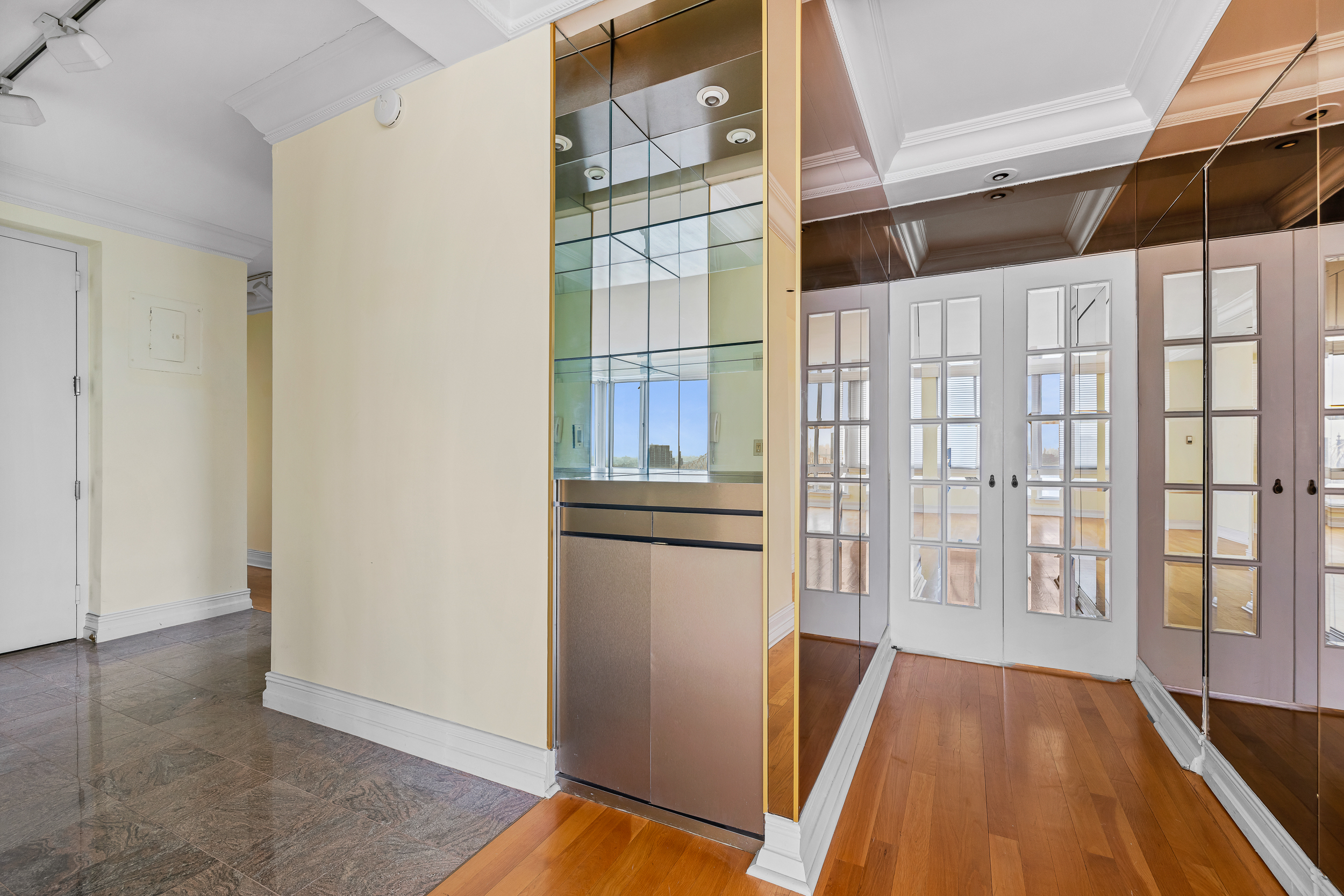 524 East 72nd Street, Unit 31AG Manhattan, NY 10021 - Photo 10 of 17 a view of a refrigerator in kitchen and wooden floor