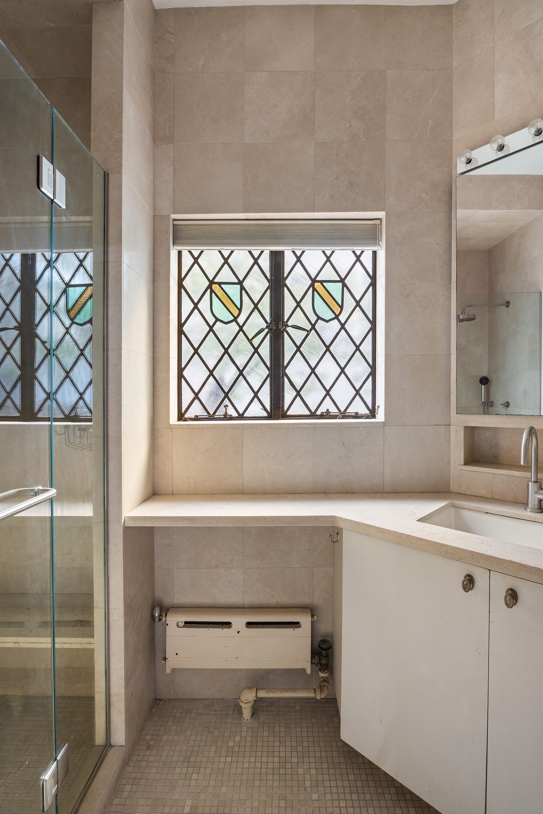 38 East 73rd Street Manhattan, NY 10021 - Photo 10 of 25 a bathroom with a sink and a mirror