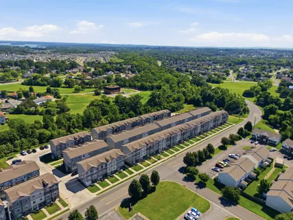 an aerial view of a house with a garden