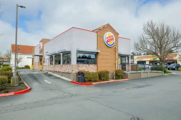 a street sign on a brick wall