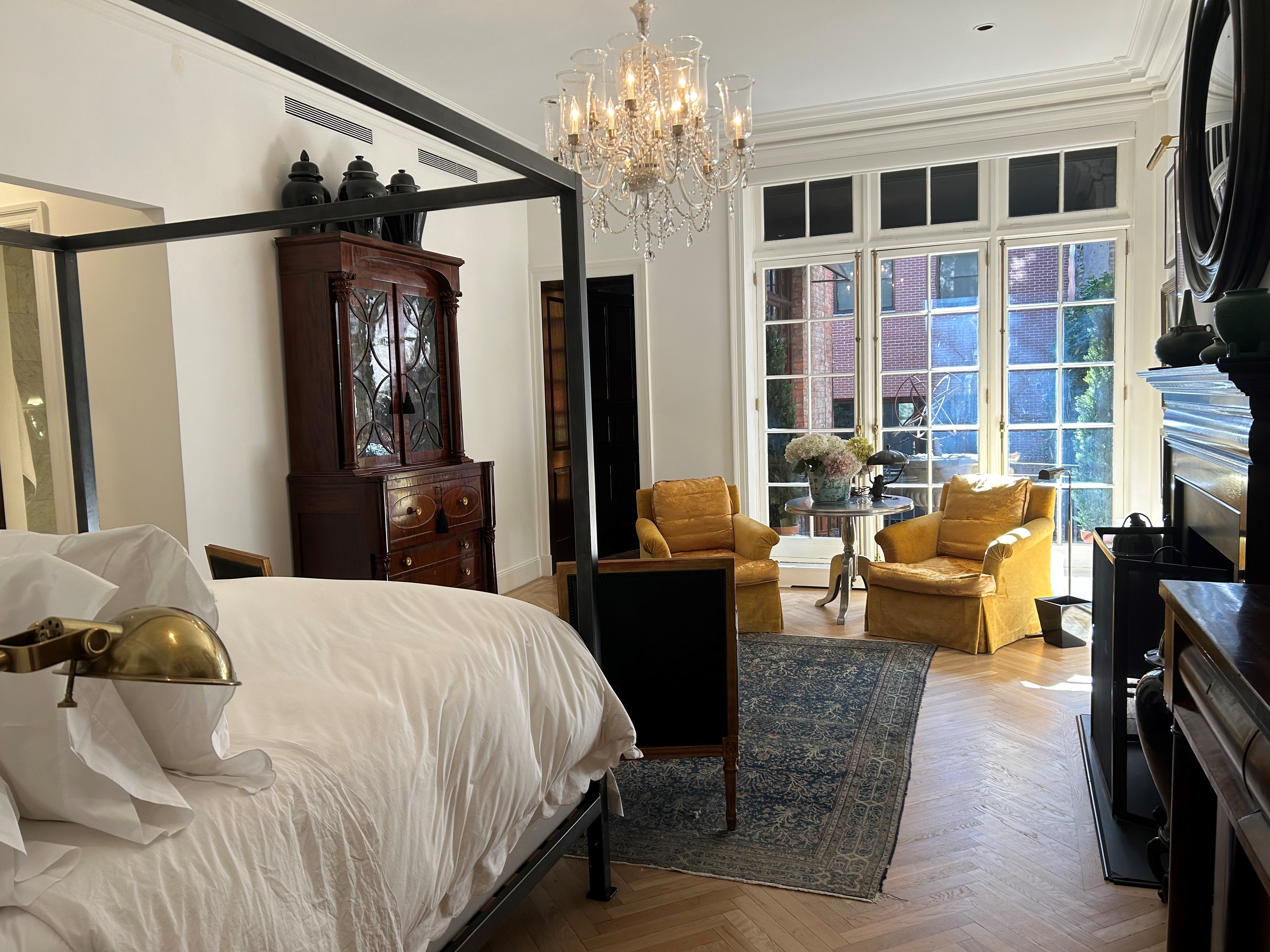 36 East 69th Street, Unit 2AB Manhattan, NY 10021 - Photo 23 of 26 a bedroom with a bed furniture and a flat tv screen