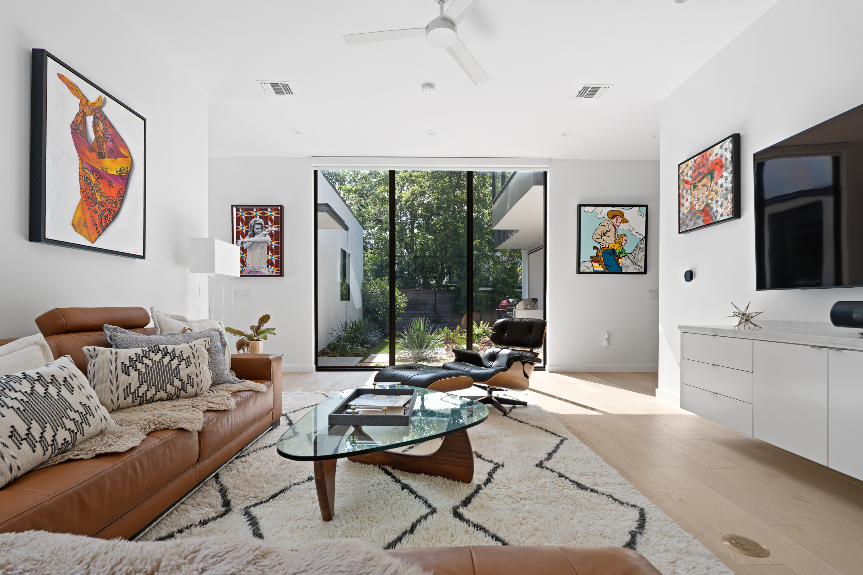 Address Upon Request Austin, TX 78704 - Photo 4 of 27 a living room with furniture a flat screen tv and a large window